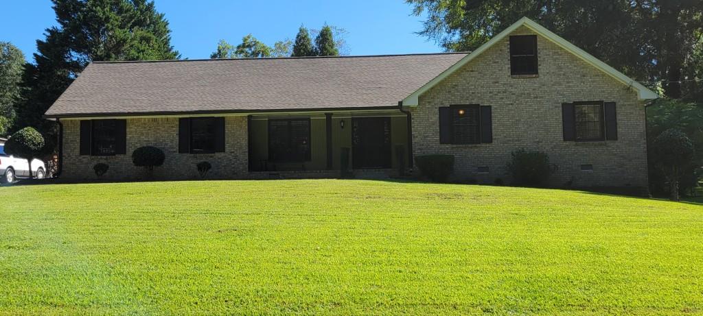 Lovely All Brick Ranch w/ In-Ground Pool, Well maintianed home with open floor plan, Large inviting Great Room w/ masonry fireplace, vaulted ceiling & hardwood floors opens to a Gentlemen's Study / possible Dining Rm. Double French doors lead to a sunny Formal Dining Rm or possible Sunroom with tiled floors and lots of windons. The Kitchen has stainless steel appliances, solid surface counter tops and hardwood flrs. A breakfast area w/ large window overlooks the back patio. Located in the Breakfast area there is an entry to a Mud room / Laundry rm and two car garage. A back stair case in the breakfast area leads to the upstairs Bonus Rm / 3rd Bedroom w/ possible walk-in closet or storage room. The Master bedroom opens to a newly renovated Master Bath w/ Jacuzzi tub, Tiled Floors, Double Vanity w/ solid surface counter tops, and Large Walk-In closet. A second full bath with Tub / Shower combo, single vanity and tiled floors connects to the Master Bath. There is also a second bedroom located on the main level. The Exterior of the home boost an In-Ground pool w/ side deck, back patio and storage building. This home is located in the Grayson school system.