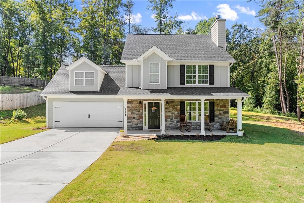 Spacious 4 bedroom, 2.5 bathroom home situated on a private 2.14-acre lot with a creek in Gainesville. This well-maintained property features a large family room with a cozy fireplace, a kitchen with custom cabinetry, granite countertops, and ceramic tile backsplash, and a generous master suite with tray ceilings, a large bath, and walk-in closet. Additional bedrooms provide flexible space for family, guests, or an office. Enjoy the privacy of a wooded lot while being conveniently located just minutes from Cool Springs Park, Murrayville Park, Publix and shopping, Highway 400, and the new hospital. A rare opportunity to own a home with acreage, charm, and convenience—all in one. Don't miss this one!