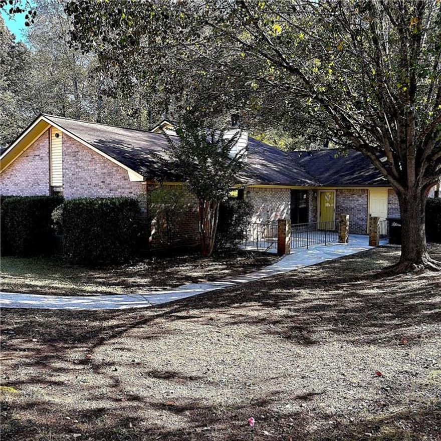 Enjoy easy one level living in this move in ready 2 bedroom 2 bath stepless end unit patio home. Nestled in a small quiet community, only short minutes to downtown Historic Marietta, you are as well near Kennesaw National Battlefield Park and its numerous outdoor amenities, Wellstar Kennestone Regional Medical Center, Life University, and major expressways. Step inside the to the spacious vaulted fireside great room and open concept dining area and on to the chef's delight kitchen offering abundant cabinetry, granite countertops, tile backsplash, gas oven/range, and refrigerator. Washer and dryer hook-ups are located in a laundry closet off the hallway. The gracious primary bedroom, offering a private full bath and his and her closets, is enhanced by glassed doors accessing the large patio with its own storage closet. The second bedroom is as large as the primary with walk-in closet closet and direct access to a sparkling full bath. Tasteful LVP flooring is found in the great room, dining area, kitchen and hallway. Assigned parking pad for 3+ vehicles. Your search stops here!