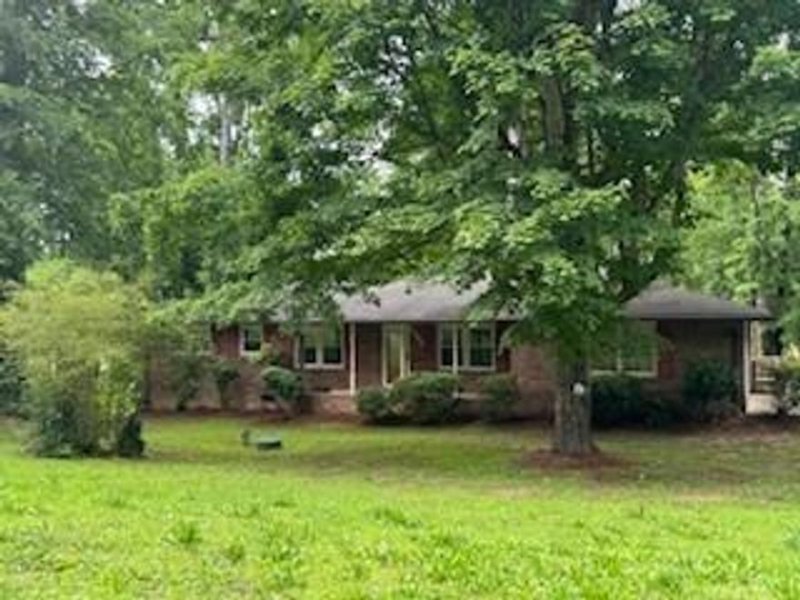 Charming Brick Ranch on lg corner lot. Well-built home is beautifully updated! 3 large bedrooms / 2 baths, this home offers a warm and inviting living area. New updates include freshly painted walls, and lovely new LVP flooring. Newer windows. All new electrical to include wiring/panel/outlets and switches! Sunny chef's kitchen w/ stained cabinets and breakfast room! Nice appliances. Enjoy the large family room perfect for entertaining and relaxation, and a formal living/dining room complete w/ fireplace. Lg laundry room. Updated Septic System. Gutter guards. Offering easy access to schools, shopping and employment. Convenient to Atlanta airport. Estate sale. Call today and let's get moving!