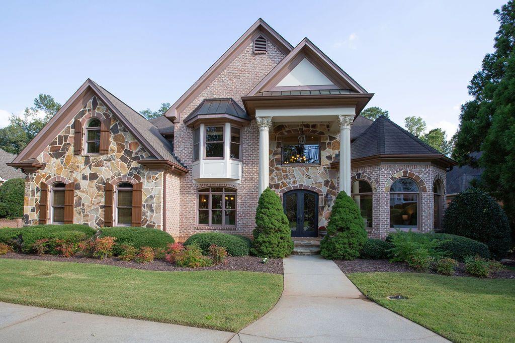 Don’t miss this BEAUTIFUL HOME with an AMAZING Clear VIEW OF GOLF COURSE!!! Hole 13, 14, and 15 in your backyard! Driving up to this brick and stone manor, you can pull right around to the front door on the curved driveway; or park your car in the large three car garage. Step up to covered entry flanked by large columns; and walk through grand iron & glass doors, greeted by a two story foyer with a beautiful chandelier, travertine floors leading to a fabulous curved iron staircase. From the foyer are spacious living areas that flow easily from room to room. Formal dining room, service bar, living room, study/flex-room, kitchen, family room and family dining area. Also a large bedroom and full bathroom on the main level. Walking through on Brazilian Cherry floors in all of these rooms. This home is full of Extras not to miss!! The formal dining room and living room have cove lighting in trey ceilings. Family room has beamed vaulted ceiling, and floor to ceiling stone wood burning fireplace. The living room has a Victorian era gas fireplace. All rooms facing the back have the amazing golf course view. Picture windows throughout. Kitchen has large breakfast bar, island with prep sink, granite counters, custom hood, uplighting and under cabinets lighting, top of the line stainless appliances, Sharp microwave drawer, built in Monogram refrigerator, separate entry from side porch and from garage. Plus a door out to a huge covered balcony. The study/flex room is massive with French window and a wall of glass doored closets, ready to fit your family needs. Through out the home you will find high ceilings, crown molding, dual zoned air conditioning, and central vacuum system with built in kitchen dust pan. Bathrooms with granite, travertine, and marble. As you come up the stairs of the curved staircase to the Upper level you will come to an open area; that steps up to another large family room/flex space. Just down the hall you will find the Primary bedroom suite, with a sitting area overlooking the golf course, gas fire place and the beautiful Brazilian cherry floors. From there enter into the primary bathroom with double vanities and a sitting vanity area, with marble counters, large shower, large soaking jacuzzi tub, private toilet, and two walk-in closets. You will also find two sizable secondary bedrooms with ensuite bathrooms, and a conveniently located laundry room. The Terrace level has more sensational views of the golf course, 11 foot ceilings, crown molding, custom wood beams, large two sided stone wood burning fireplace, beautiful designer exposed brick walls, wine cellar, large pantry/finished storage area, huge entertainment space with kitchen and bar, large bedroom with full bathroom, and bonus finished space for a movie room (sound proof) or more storage. Walk out to a covered terrace and flat back yard with sprinkler system. The yard is perfect for adding your own private pool. You could walk straight out to the Green. MAKE THIS DREAM HOME YOURS! Polo Golf & Country Club has a very reasonable HOA. The Country Club membership is optional and has several levels available.