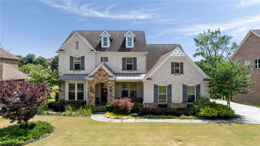 Welcome to your own FIELD OF DREAMS! This classically designed New England Traditional meets Farm-House Fusion is drop-dead GORGEOUS, boasting recent renovations, chic finishes, and an incomparable view. Impossible to find “FOREVER VIEWS” of the beautiful Nature Preserve that will NEVER BE BUILT ON! This is a passive park (walking only) that’s dedicated to ONLY serve the prestigious Reserve at Old Atlanta community …………………………………….. The RECENTLY RENOVATED KITCHEN boasts quartz countertops featuring a massive island capped with double waterfall edges. Top of the Line Appliances! You will LOVE the Herringbone pattern hand-cut Italian marble backsplash and Restoration Hardware fixtures! Your grand, vaulted PRIMARY SUITE ON THE MAIN level delivers Knock-Your-Socks-Off views provided by a wall of massive picture windows. Just imagine waking every morning to serene pastoral landscape vistas, where you will see Canadian geese, deer, fox, owls, hawks, and innumerable birds dancing among the various perennial blossoms in your painstakingly landscaped and irrigated gardens! Also, you will love a SECOND Bedroom and Full Bath on the Main...Perfect for guests! The COMPLETELY FINISHED & RENOVATED TERRACE LEVEL makes a perfect Teen or IN-LAW SUITE providing both form and function: Large living room, spacious bedroom and bath, and A FULL KITCHEN. The second lower level bedroom features a dog -or kid! - washing area! This beautiful home is in the original “premier” section of the community. Constructed by renowned builder David Weekly, you’ll notice soaring vaults, 10’ ceilings, and significant molding and finishes. Extremely rare, and best possible lot location….Far enough from the gate to afford peace and quiet yet close enough for an easy stroll to the amenities.