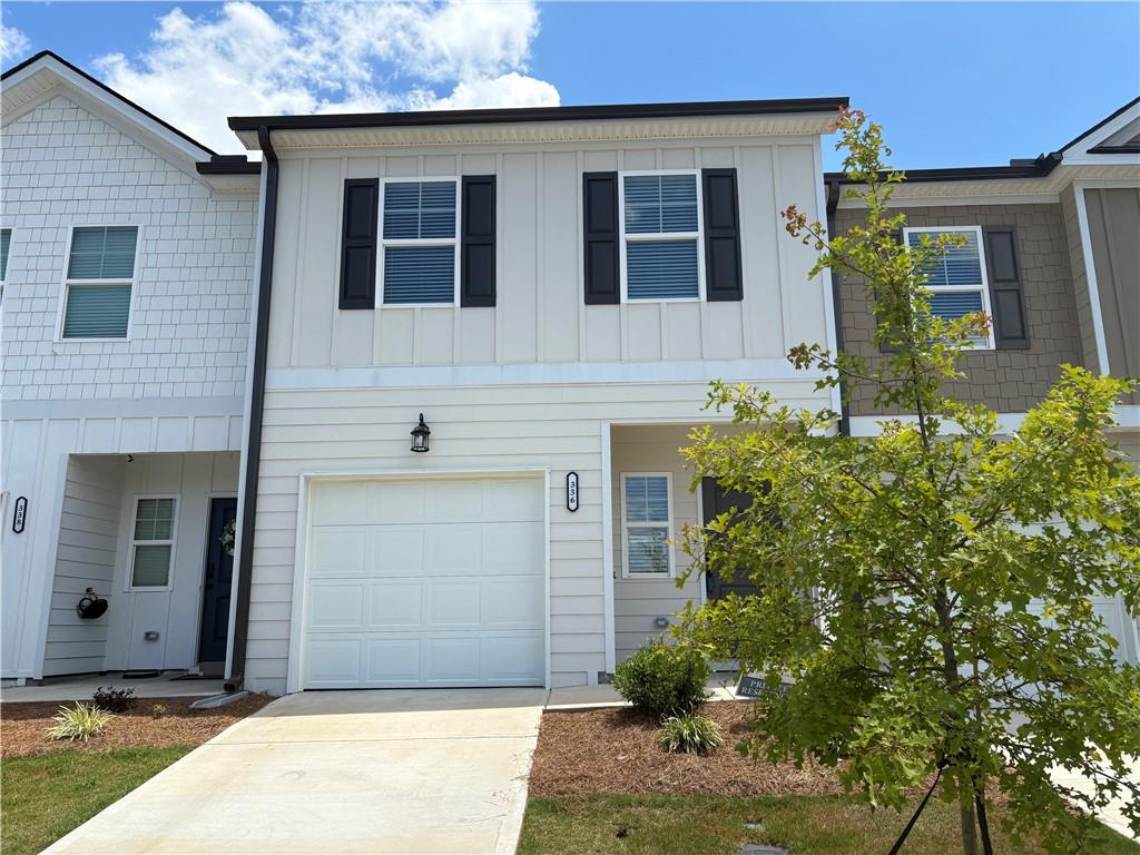 Welcome to this beautifully maintained, nearly new 3-bedroom, 2.5-bath townhome located in one of Hoschton’s most desirable swim communities! Designed with comfort and style in mind, this townhome features a bright, open-concept layout that seamlessly connects the family room, dining area, and kitchen—perfect for entertaining and everyday living. The kitchen is a standout, boasting granite countertops, a spacious center island, stainless steel appliances, and a large pantry. State-of-the-art flooring runs throughout the main level, adding a touch of elegance and durability. Upstairs, the oversized master suite impresses with a spacious walk-in closet, a separate soaking tub and shower, and generous space for relaxing. Two additional bedrooms are thoughtfully positioned on the opposite side of the townhome for added privacy, and the convenient upstairs laundry closet makes chores a breeze. Step outside to your private patio—ideal for outdoor dining, grilling, or simply unwinding. The community is perfect for walking, jogging, and enjoying the outdoors, with a refreshing pool just down the street. Hoschton offers the best of both worlds: small-town charm with big-city convenience. Enjoy nearby shopping, dining, and entertainment, all within easy reach of Atlanta. Don’t miss this exceptional opportunity—schedule your tour today!