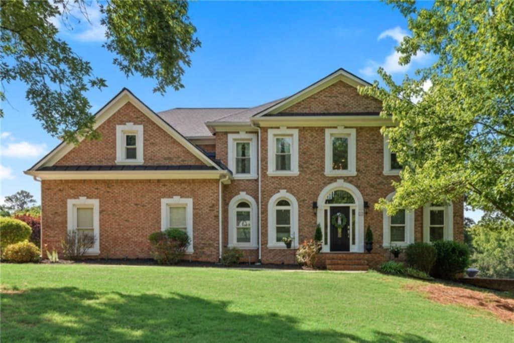 Nestled on 8 serene acres, this three-sided brick estate offers the perfect balance of luxury living and equestrian lifestyle. Ideal for horse enthusiasts, it features a two-stall barn with water and electricity, a welcoming paddock, and a 110’ x 80’ riding arena with 4” deep, footed sand. The barn also includes an RV hookup, power for a hot walker in the paddock with a lean-to shelter, a wash rack, and concrete floors in both the barn aisle and wash rack. You’ll find tons of storage inside, plus two enclosed lean-tos for additional storage. The barn can easily be configured for a third stall or washroom, making it fully adaptable to your needs. Most of the property is fenced in lush pasture with four-board fencing, plus a separate fenced area for dogs. Inside, a grand two-story foyer opens to hardwood floors throughout the main living spaces. The main level boasts a private guest suite with full bath, an exquisite chef’s kitchen with large island, perfect for entertaining and open to a dramatic two-story great room with floor-to-ceiling windows. Enjoy gatherings in the bright breakfast room/sunroom with sweeping pasture views. A formal living room (ideal for an office) and a separate formal dining room complete the main floor. Upstairs, the oversized owner’s retreat showcases a brand-new, beautifully renovated spa-style bath, his/hers closets, and a flex room perfect for a home office, nursery, or gym. Three additional spacious bedrooms, including one with a private en-suite, plus a newly updated hall bath, offer plenty of space for family and guests. The finished terrace level offers endless possibilities….rec room, media space, gym/office, custom bar, full bath, and a second laundry room already plumbed for a kitchen, making it ideal for an in-law suite. It also includes a third-car garage with ample space for a boat, lawn equipment, or workshop. Outdoor living shines with a sparkling in-ground saltwater pool, expansive sun patio, and panoramic views of the rolling landscape...your own private oasis! Recent updates include new windows, new roof, and top-of-the-line HVAC. Zoned A1, this property welcomes all your animals! Just minutes from Silver Comet horseback riding trails, 45 minutes to the Atlanta Airport, and convenient to Hwy 278, Wellstar Medical Center, shopping, dining, and schools. With its blend of privacy, elegance, and equestrian amenities, this property delivers a truly rare lifestyle opportunity.