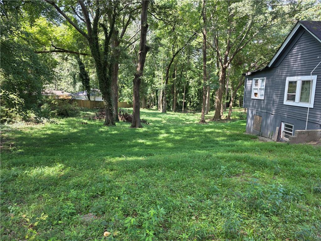 It is an investor’s dream for the opportunity to own a prime piece of land to develop and build their dream
project on. Whether you're building your dream home, townhomes, row homes or a rental property, 892
Ridge Avenue is the perfect canvas for your vision. This spacious, beautiful lot is zoned R5 which
accommodates larger multi-family buildings like townhomes and row houses; the possibilities are endless.
Don't miss this gem of a great opportunity in a growing neighborhood which includes several
newly constructed homes, as well as homes currently under construction. There is currently a 1,256 sq. ft.
home on the property which can be re-purposed or demolished. All utilities are readily available.
The property is within quick access to Interstates 285 and 20 and conveniently located within close proximity
to downtown, Atlanta; the Mercedes Benz Stadium; State Farm Arena; The Georgia Aquarium; Atlanta
Hartsfield-Jackson International Airport; parks, colleges, Universities and so much more. Don't miss out on
this hidden gem in a growing, neighborhood.