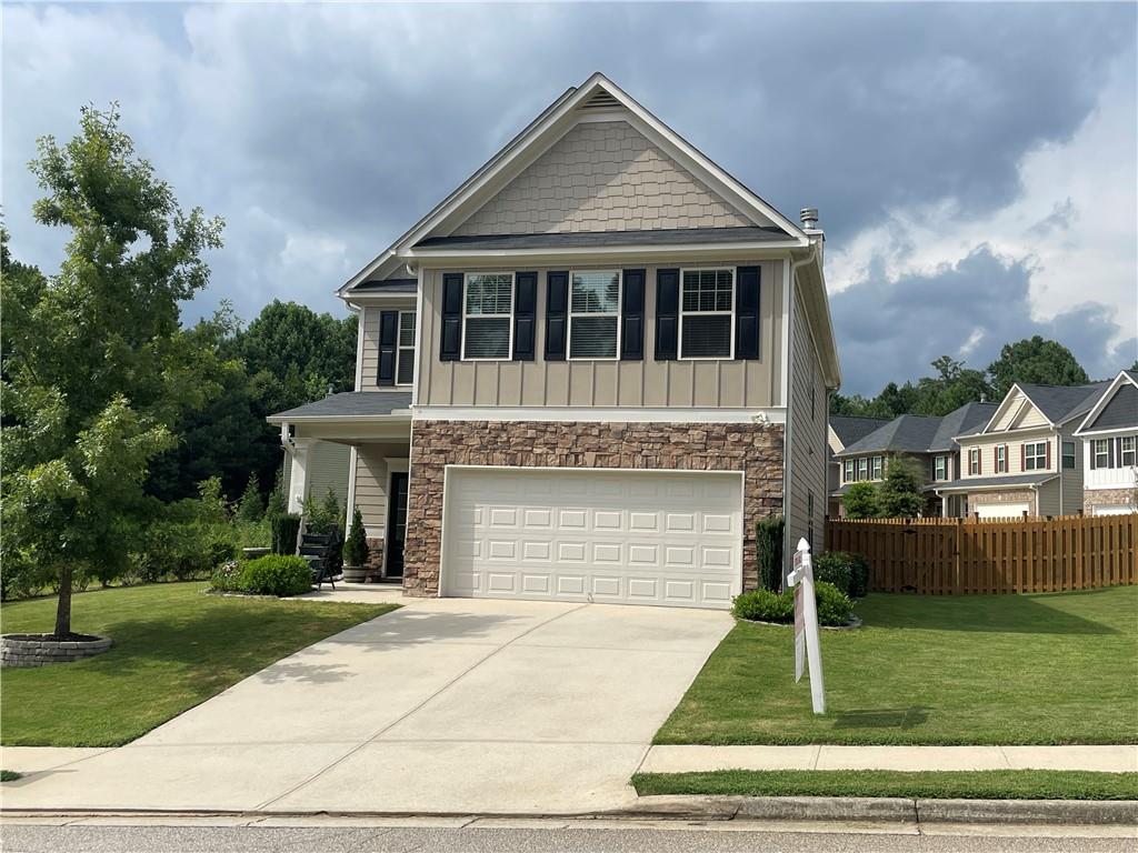 This beautiful home features 4 bedrooms plus a loft area, perfect for a den or office. Formal dining room and an additional eating area off the kitchen. Large kitchen island, granite countertops and 42" cabinets. Walk in pantry so there is plenty of cabinet space in your kitchen. Living area has a fireplace and there is LVP flooring in all the downstairs. Upstairs you'll find a huge owners suite with large walk in closet. The master bath has a soaking tub and separate shower with double vanity. There are 3 additional bedrooms and an additional bathroom upstairs. The home is situated on a corner lot with a green space next to the property making the lot very private. The big back yard is completely fenced. This quiet neighborhood is conveniently located between I 985 and I 85 and 1 mile from the Mall of Georgia.