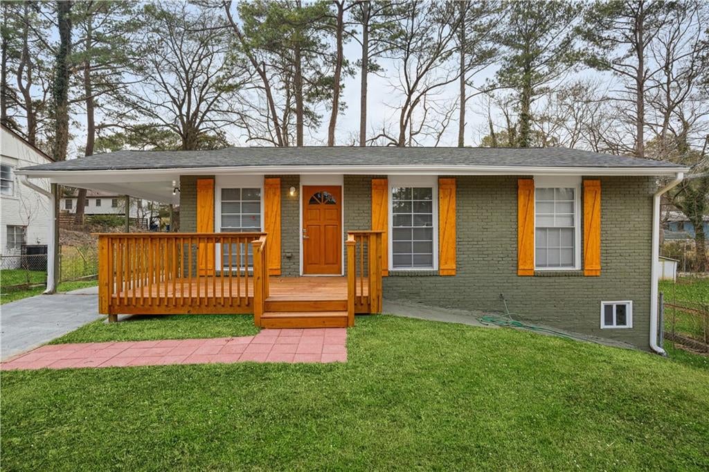 View of front of property featuring brick siding and a porch