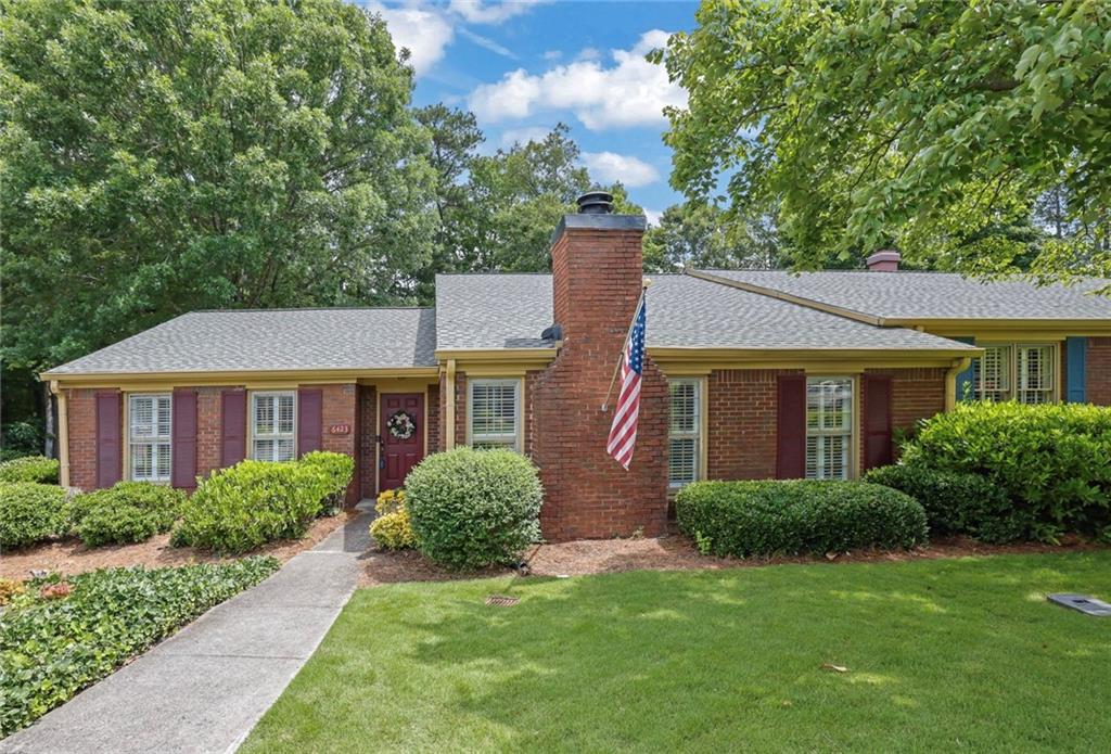 Welcome to 6423 Deerings Lane in desirable Peachtree Corners! This corner end-unit townhome features 2 spacious bedrooms, 2 full bathrooms, and a versatile den with a cozy fireplace perfect for relaxing or working from home. You'll love the inviting layout with a bright kitchen, dedicated dining area, and comfortable living space. The primary bathroom includes handicap-accessible features such as grab bars, a raised toilet, and a step-in tub. The entire interior has been freshly painted and professionally cleaned from top to bottom, including carpets, making this home truly move-in ready. Enjoy your private fenced courtyard with a covered walkway that leads directly to your enclosed 2-car garage. This well-cared-for gem is ready for its new owners! *Please remove shoes or wear shoe covering when entering the home*