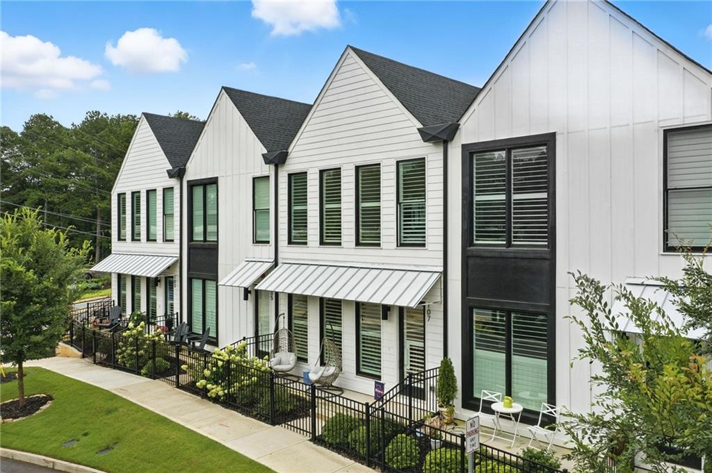 Enjoy living your best life in Downtown Woodstock! This townhome is walking distance to all that Downtown has to offer - restaurants, entertainment, breweries, parks, shopping, concerts and more! This home was just built in 2022 and is in immaculate condition. It features the owner's suite on the main level, quartz countertops throughout, an upgraded elevation that offers tons of windows to bring in natural light, plantation shutters, durable LVP flooring, upgraded plumbing fixtures, 8' doors throughout the main level, a large walk-in shower, a spacious walk-in closet, a large bonus room + two bedrooms and a bathroom upstairs, space in the basement that could be finished for more square footage and so much more. The location also offers quick and easy access to The Outlet Shoppes at Atlanta, Towne Lake, healthcare offices, grocery shopping and I-575.