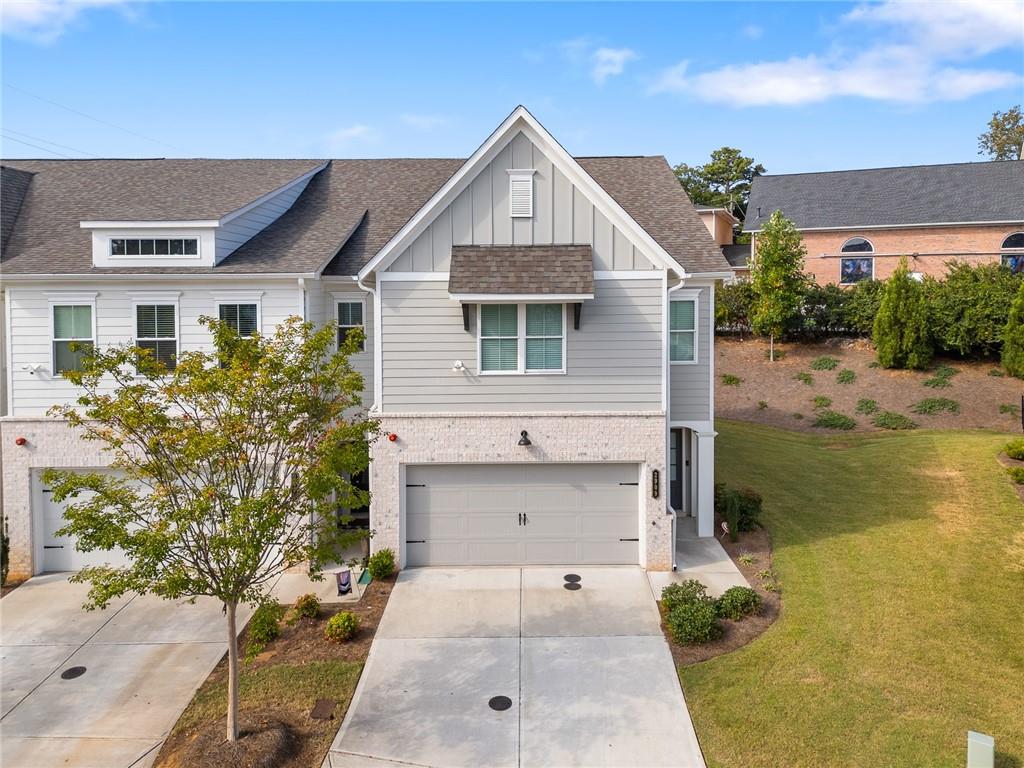 Welcome to this stunning 3-bedroom, 2.5-bathroom end-unit townhome, formerly the model home by Traton Homes, built in 2023 and priced to sell!
Located in a prime Smyrna location, this modern home offers a spacious and open-concept main level featuring luxury vinyl plank (LVP) flooring throughout, crown molding, blinds. The kitchen is the focal point with white shaker cabinets, an oversized island with quartz countertops, a walk-in pantry, and stainless steel appliances—overlooking the bright family room and dining area. A convenient powder room is available for guests. Upstairs, the oversized primary suite features an ensuite bathroom with a double vanity, walk-in shower, and a large walk-in closet. The laundry room is ideally located just outside the primary bedroom. Two additional bedrooms and a full bath complete the second floor. Additional Features Include: End-unit location with extra privacy and natural light, fenced in backyard, blinds installed on all windows, LVP flooring throughout both levels – no carpet (except the stairs for style and safety) Energy-efficient construction and low maintenance living. Location Highlights: Walk to Ruby’s Sourdough Pizza with outdoor seating, One minute to Legacy Golf Links & Fox Creek Golf Club, just a short drive to The Battery Atlanta & Truist Park. Easy access to shopping, dining, and I-75/I-285. This move-in ready home combines modern style, unbeatable convenience, and community amenities such as the pool and cabana—don’t miss this opportunity!