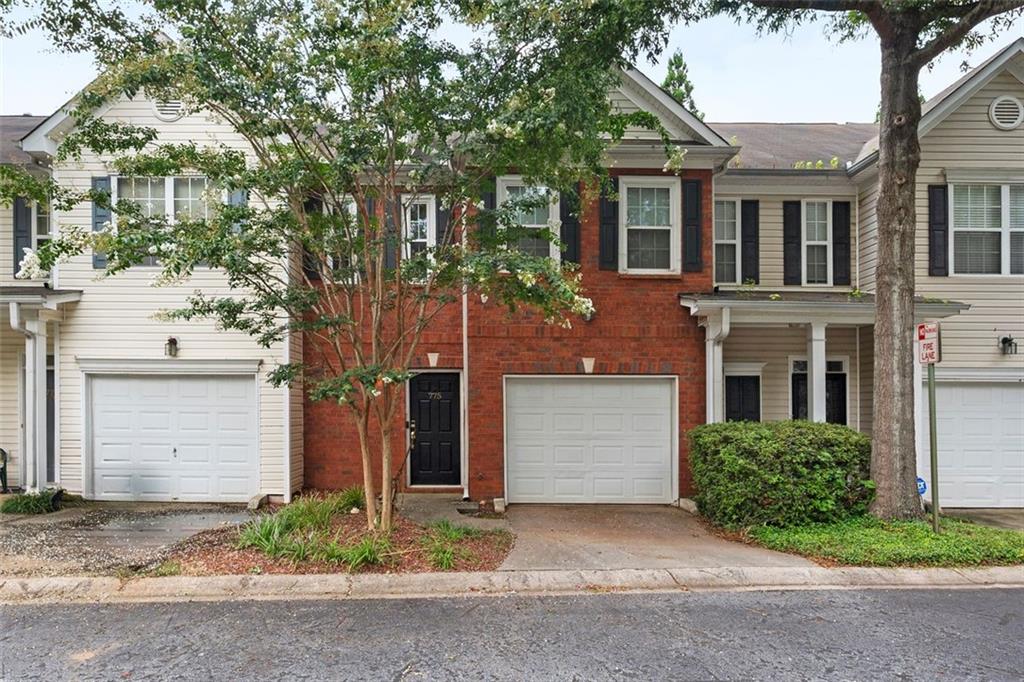 Welcome to 775 Nehemiah Lane SW—a charming two-story brick townhome that perfectly blends timeless curb appeal with smart, thoughtful upgrades throughout. From the moment you arrive, you’re greeted by a manicured lawn, lush landscaping, and a vibrant tree that adds natural character to the front yard. A classic black door with gold hardware opens to light-filled living spaces, where large energy-efficient windows and a 2018-installed patio door bring the outdoors in and create a warm, inviting feel. This home is filled with updates designed for comfort, efficiency, and peace of mind. A BRAND NEW ROOF offers major value and durability for years to come. The Ring doorbell and ULTRALOQ smart lock (installed in 2017 and 2018), a 2017-updated HVAC system, and Nest thermostat deliver modern security and year-round comfort. A secondary Honeywell thermostat (added in 2019) allows personalized climate control. The attached garage, enhanced with a Chamberlain MyQ Wi-Fi Smart Hub, makes access easy—and for EV owners, a 240V charging plug is already in place. The kitchen features brand-new stainless steel appliances—refrigerator, oven, and microwave—all installed in 2024, giving you a fresh and functional cooking space from day one. The water heater, replaced in 2014, rounds out a list of quality upgrades that make this home truly move-in ready. Nestled in a well-maintained community and complete with a spacious driveway and garage, this townhome offers the perfect mix of classic charm and modern-day ease. Schedule your private tour today—this meticulously cared-for home won’t last!