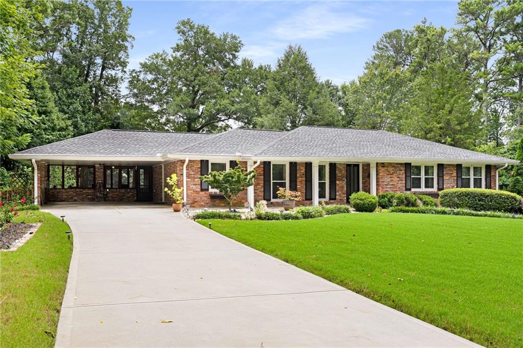 Welcome home to this spacious and stylish 4-bedroom, 3-bath brick ranch sitting on a nearly ½-acre lot in one of the area’s most desirable school districts. This move-in-ready gem offers a perfect blend of modern upgrades and classic charm. The main level boasts 3 bedrooms and 2 full baths, with hardwood floors throughout and an open, flexible floor plan ideal for both everyday living and entertaining. The updated kitchen features granite countertops, stainless appliances, ample cabinet space, and flows seamlessly into the dining and living areas. Downstairs, you’ll find a finished bedroom and full bath—perfect for guests, in-laws, or a private office—plus a large unfinished area ideal for a home gym, workshop, or extra storage. Bonus: the seller is including the sauna for the lucky new owner! Enjoy outdoor living year-round with a screened porch overlooking the beautifully landscaped backyard complete with a fire pit—great for gatherings or relaxing under the stars. Additional features include: Energy-efficient newer windows throughout, UV air purifier added to HVAC system, Upgraded driveway, and 2-car carport. Pack your bags and move right it.....