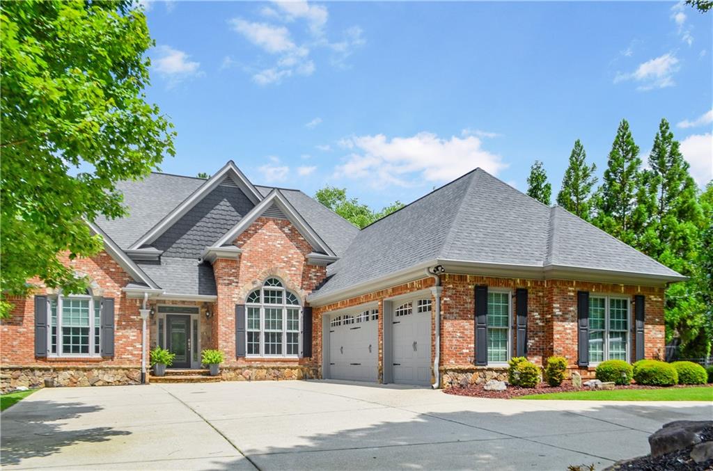 Beautiful all-brick ranch with a finished terrace in the gated Chateau Elan community! This home feels like a private resort, featuring a Pebble-TEC heated pool and spa, a fenced backyard, and exclusive deeded access to the neighborhood pond just steps away—perfect for relaxing and enjoying nature. Beautifully maintained, the home boasts freshly refinished hardwoods on the main level and a newly repainted interior. The spacious kitchen and inviting keeping room, complete with a stone fireplace, flow into a vaulted screened porch, formal dining, and living rooms, creating wonderful spaces for gatherings. The main level includes a generous owner’s suite, a guest bedroom with its own ensuite bath, and an additional bedroom with a full bath that could be as a charming office. The finished terrace level is ideal for entertaining, with a bar, theater room, and recreation room, plus a large bedroom, full bath, exercise room, and ample storage or workshop space. Outdoors, you’ll find a spacious 3-car garage with a circular drive, professionally landscaped grounds, and an irrigation system. This impeccably cared-for home is ready for its next owner, with nearly everything updated, including the roof, windows, water heaters, and pool equipment!