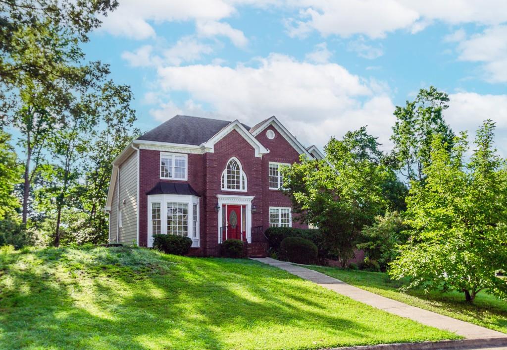 Welcome to this traditional two-story home ideally situated on a corner lot in the desirable Steeple Chase swim/tennis community. Newly refreshed with new carpet and paint throughout the entire house, just bring your finishing touches! Stay comfortable with a brand-new A/C system on the main level. Located in the highly sought-after Peachtree Ridge School District and just minutes from shopping, schools, and I-85, this home offers convenience and lifestyle. Step into the impressive two-story foyer with gleaming hardwood floors that set the tone for the rest of the home. The spacious kitchen features stainless steel appliances, double ovens, a breakfast bar, and a bright breakfast room perfect for casual meals and gathering with family and friends. Host dinner parties in the elegant formal dining room, ideal for entertaining guests. The fireside family room boasts a vaulted ceiling, abundant natural light, and an open, airy feel that adds warmth and charm. The primary suite is tucked away on the main level for added privacy and includes a luxurious en-suite bath with a garden tub, separate shower, double vanity, and a generous walk-in closet to help keep you organized. Conveniently located on the main floor, the laundry room makes chores a breeze. Upstairs, you'll find three spacious secondary bedrooms, each with ample closet space and thoughtful storage. A catwalk overlooks the stunning two-story family room below, adding architectural interest. But there's more don't miss the finished basement! Whether you envision a media room, home gym, office, or playroom, this versatile space is ready to meet your needs. The basement also includes a full bath and plenty of additional storage. Step outside to the oversized deck, perfect for hosting cookouts, enjoying morning coffee, or relaxing in the evening. Double doors from the family room lead right out to this wonderful outdoor space. Put your personal touch on the spacious, level backyard with a little TLC, it can become the outdoor haven you've been dreaming of. This home truly offers something for everyone don't miss your chance to make it yours!
