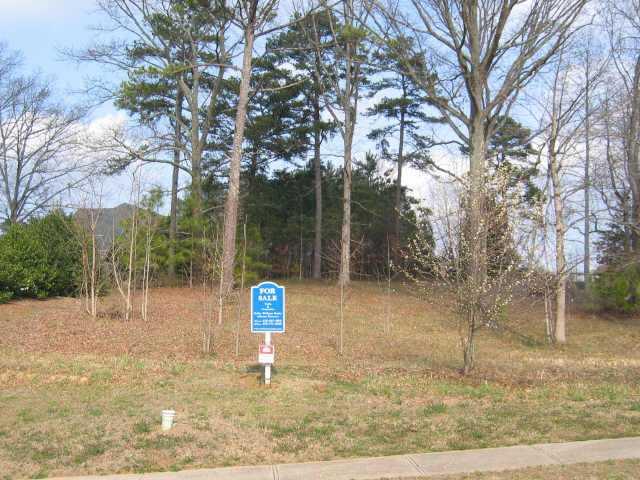 GREAT PRVT, WOODED LOT IN GATED COMMUNITY! AWESOME LOCATION WHICH IS IN WALKING DISTANCE TO THE CLUBHOUSE & THE SPORTS CENTER. FULL GOLF CHARTER MEMBERSHIP AVAILABLE. MUST USE PREFERRED BUILDER.