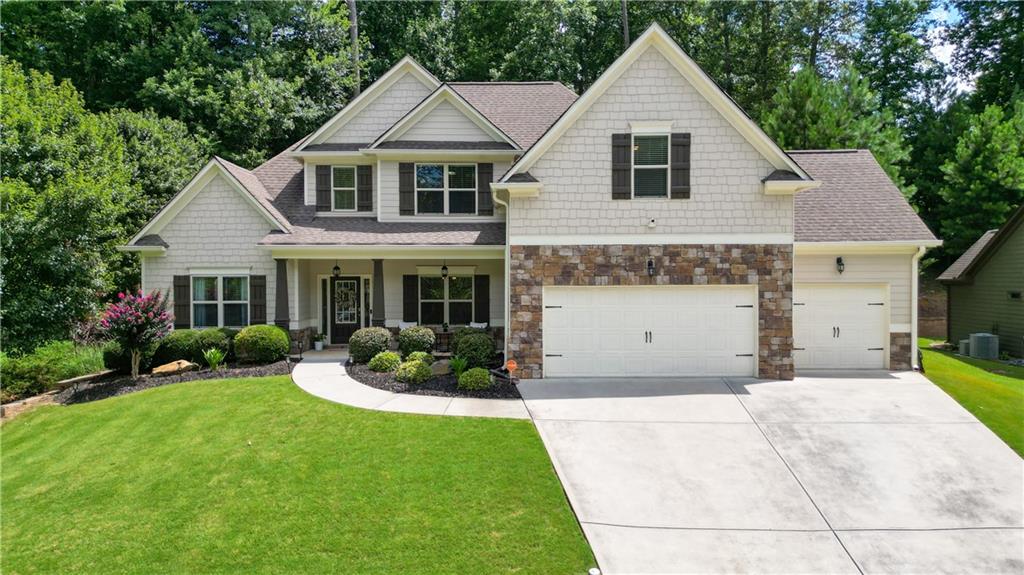 This lovely 4 bedroom, 2 1/2 bath home is located in the desirable Sedgefield Community in Dallas, Georgia. The home greets you with a gracious open floor plan, abundant natural light, and beautiful finishes throughout. The Great Room is remarkable- featuring soaring ceilings and a 2-story stacked stone fireplace. This gathering space is inviting and will set the cozy atmosphere for many memorable Holidays ahead!
The Primary Bedroom is ideally located on the main level, and the additional bedrooms are on the second level of the home. The Primary Bedroom also offers dual walk-in closets and dual vanities as well.
The chef's Kitchen is the perfect place for all to gather around the large island. The Breakfast Nook is situated within the open Kitchen to offer an additional option for dining. With natural stone countertops, stainless steel appliances and a gas range, this Kitchen is sure to be the heart of the home!
Additional features of this home are a dedicated Laundry Room, hardwood floors on the main level, a Covered Patio that is perfect for entertaining, a large walk in Pantry and a formal Dining Room with a beautiful architectural trimwork. The backyard offers terraced landscaping, complete with lovely established rosebushes, lilies and peonies- with twinkling solar lights for evening enjoyment of your peaceful retreat. The storage shed off to the side is perfect for additional storage of garden tools, as well.
One of the most exciting attributes of this home is the large epoxied 3-car Garage! It's perfect for accommodating larger vehicles due to its roomy dimensions. Complete with abundant task lighting and an electric vehicle charger- this Garage has to be seen in person!
The Sedgefield neighborhood offers a Pool and Playground and is close to Costco, shopping and local trails. Inquire for further details and to schedule a showing!