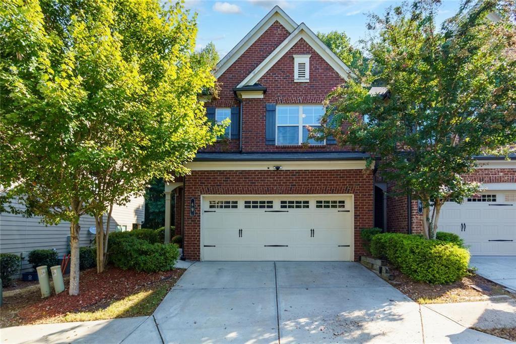 Don’t Miss This Stunning End-Unit Townhome in Prime Lawrenceville! The best part: Sellers are motivated and offering $4,000 toward closing costs PLUS a 1-year Choice Home Warranty!
This home is a move-in ready brick-front end-unit townhome that checks all the boxes! Built in 2017, this beautifully maintained home offers 1,825 sq. ft. of open-concept living designed for comfort, style, and entertaining. Conveniently located just minutes from Hwy 85, Sugarloaf Mills, restaurants, shopping, and parks, this home delivers the perfect everyday convenience. Step inside to a bright and spacious main level featuring hardwood floors, fresh paint, and plenty of natural light. The kitchen — complete with stone countertops, shaker cabinets with crown molding, a stylish backsplash, stainless steel appliances, and a large island with bar seating. It’s perfect for preparing meals, casual dining, or hosting family and friends. The open floor plan flows seamlessly into the living room, where a cozy fireplace adds warmth and charm. Upstairs, the primary suite is a private retreat, boasting a tray ceiling, large walk-in closet, and spa-like bath with double vanity, soaking tub, and separate shower. Two additional bedrooms and a full bath provide flexibility for guests, home office, or hobby space. The backyard is truly an entertainer’s dream! A private fenced patio with string lights and a custom fire pit sets the scene for unforgettable evenings outdoors. Additional highlights include crown molding throughout, and a well-kept community that reflects pride of ownership.
This home is more than just a place to live — it’s a place to thrive. Don’t wait — schedule your showing today and make this desirable Lawrenceville end-unit yours before it’s gone!