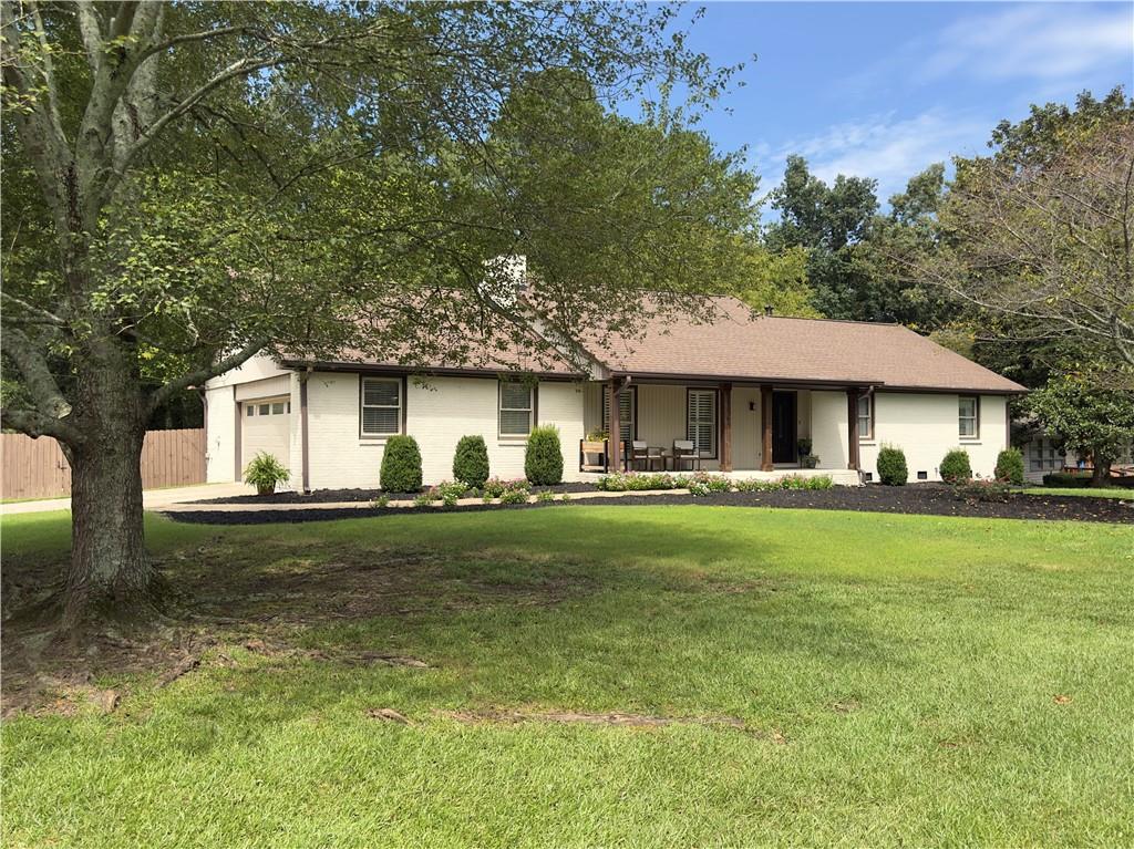 Charming Lakeview Brick Ranch Awaits You! Welcome home to this delightful, fully updated 2,496 sf brick ranch, where modern comfort meets peaceful lakeside living. This charming residence radiates warmth and relaxation, making it the perfect place to move in and start creating cherished memories. As you approach the home, you'll be greeted by its inviting curb appeal and a lovely front porch that beckons you to unwind. Imagine sipping your morning coffee here, soaking in breathtaking sunrises over the tranquil lake-there's no better way to start your day! Step inside to discover a beautifully renovated interior that radiates coziness and sophistication. The spacious living areas are filled with natural light, highlighting the tasteful finishes and open layout that seamlessly connect the living, dining, and kitchen spaces. Perfect for both entertaining and everyday living, this home invites you to relax and enjoy life to the fullest. The kitchen is a chef's dream, featuring modern appliances, a water filtration system, and ample counter space, all complemented by a stylish design that encourages culinary creativity. Whether you're preparing a simple meal or hosting a dinner party, this space is sure to impress family and friends alike. As the day winds down, transition to your private backyard. This outdoor oasis is the perfect venue for entertaining guests or enjoying quiet evenings with loved ones, or simply relaxing with a good book as the sun dips below the horizon. Front and back yards have landscape lighting. Retreat to the comfortable bedrooms, where restful nights await. Each room is generously sized, offering plenty of space for personalization. The bathrooms have also been thoughtfully updated, ensuring that both style and function are at the forefront. Located in the peaceful and welcoming Lake Jodeco neighborhood, this home provides easy access to local amenities, all while maintaining a sense of privacy. The lake offers opportunities for fishing, kayaking, and leisurely strolls, allowing you to fully embrace the beauty of nature right at your doorstep. Whether you're a first-time homebuyer or looking to downsize, this enchanting brick ranch promises a lifestyle filled with comfort, joy, and unforgettable moments. Don't miss your chance to call this captivating property your new home-schedule a viewing today and experience the magic for yourself!