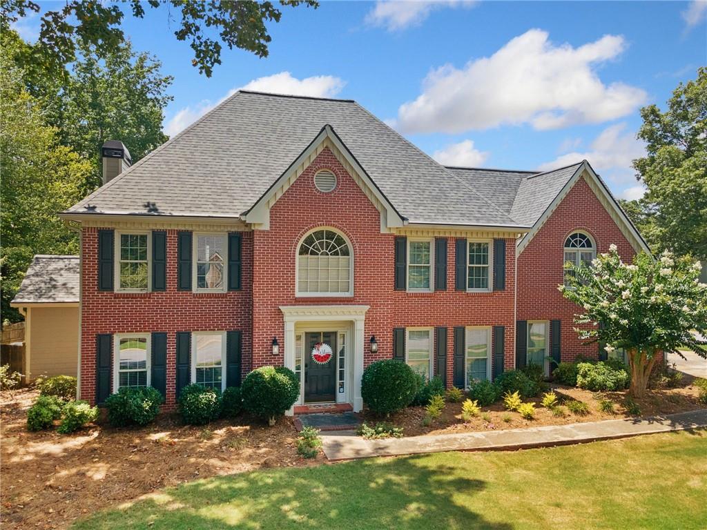 Live the American dream in a neighborhood where everybody knows your name, greets you with a smile, kids meet at playgrounds, pools, ride bikes in the streets and a clubhouse and country club to spend with family and friends. This traditional home is nestled in the heart of it all on a corner lot, 3 car garage. Third garage is on the far side of the house. fenced in backyard with all-weather sun room, and gorgeous landscape for a private oasis to enjoy. Step inside to timeless finishes and a welcoming floor plan. This home was built to enjoy quiet family time to holiday parties. Open concept kitchen w/ panoramic views to back yard, sun room, and living room, separate dining and private office all on the comfort of the main floor. Upstairs you will find a private owners retreat, flax space for anything you choose and generous-sized secondary bedrooms. This home is everything charming and cozy. In the heart of all things West Cobb where schools are sought after where local cuisine and small owned business and enjoyed and loved.
