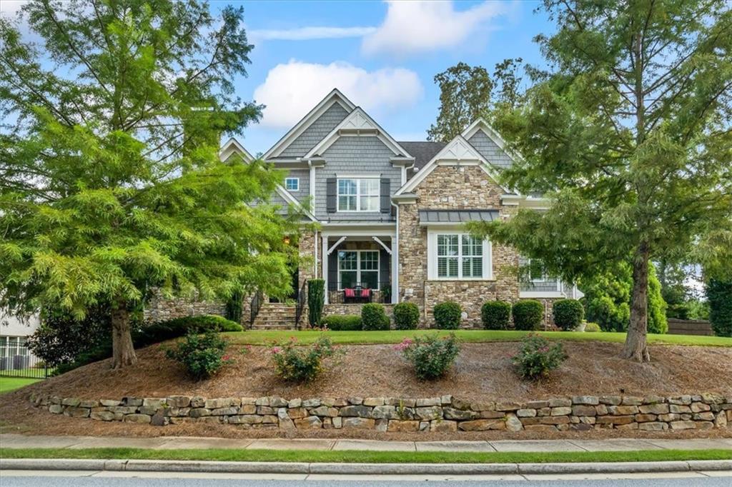 Welcome to this truly exceptional family home! Located on a cul-de-sac in an enclave community of executive style homes. A comfortable blend of elegant sophistication, high quality craftsmanship and distinctive appointments enhance this ideal open floor plan perfect for today’s easy lifestyle. The home offers graciously sized rooms on three full finished levels. An impressive 2 story foyer invites you inside to a seamless flow of gleaming hardwood flooring continuing throughout most of the main level. An elegantly appointed dining room affords the perfect atmosphere for more formal mealtime gatherings. Off the Foyer is a private room perfect for a home office, music room, or formal living area. The main level entertaining area features a large family/great room which is open to the breakfast area and gourmet kitchen. All of this area enjoys a view of the magnificent, private pool, spa, firepit, covered outdoor seating area with TV and a grill with accompanying green egg to help prepare a feast for family and friends. Completing the main level is a luxurious Owner's suite providing a lovely view of the pool, and helpful closet built ins to maximize space for your wardrobe. On the top floor you'll find a barn door entrance to a step up bonus room/den/kids play area, etc. plus 4 additional bedrooms and 3 full baths. Two of the bedrooms have ensuite bathrooms, while a third bedroom has private access to a third bathroom. In the terrace level you'll enjoy a huge open area for entertaining! That includes an area for gaming tables such as a pool table/ping pong, a kitchenette, and lounging/TV area. Off of this area is a bedroom, full bath, wine cellar, workout room, and a theater room with a platform for theater chairs, if desired. Please schedule a showing...You won't be disappointed!!!