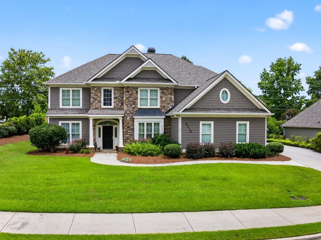 This Buford Beauty is Maintained to PERFECTION, Immaculate and MOVE-IN Ready!! Excellent Location in the Award-winning NEW Seckinger HS District! This is the Nation's FIRST AI-themed HS!! Amazing Features of this home include a Soaring 2 Story Family Room with Double Sided Wood Burning Stone Fireplace, Beautiful Updated Granite Kitchen with Hardwood Floors, Stainless Steel Appliances including Gas Range & Refrigerator, Tile Backsplash, Walk-in Pantry & View of the Fireplace!! The Warm Kitchen leads to a Bright and Airy Sunroom with newly installed Vertical Sliding Windows & Tile Flooring! Also, on the MAIN level is a convenient GUEST Bedroom and Full Bath, Formal Living Room (or OFFICE) & Banquet Size Dining Room w/Hardwood Floors! The Two Story Foyer also has Hardwood Floors and leads to an Upper-Level Spacious Owner's Suite with a Cozy Gas Fireplace! Enjoy your Gorgeous En-Suite Bath that has a Step-in Tile Shower with Rain Showerhead, Dual Vanities & Two Oversized Walk-In Closets!! Additionally, there are 3 very Spacious Secondary Bedrooms and a Full-Size Tiled Bath with Dual Vanities! Some FEATURES you'll LOVE are THREE CAR SIDE-ENTRY Garage with Painted Flooring & Utility Sink, Recently Painted Hardiplank Siding, Newer Roof (4yrs), Transferable Termite Bond, Ceiling Fans throughout, Custom Window Treatments & Security System! This Home has CURB APPEAL, situated on a Beautiful, Manicured Level Lot with a Private Backyard that includes a Firepit Patio perfect for relaxing and Entertaining! Ellsworth is a POPULAR Buford Swim/Tennis Community located just minutes from Lake Lanier and convenient to I-985 & I-85, Mall of Ga, and Top-Rated DINING and shopping! Don't miss this OPPORTUNITY to schedule your private tour TODAY to view this Buford Beauty in the Seckinger High School Cluster, known for INNOVATION and EXCELLENCE!
