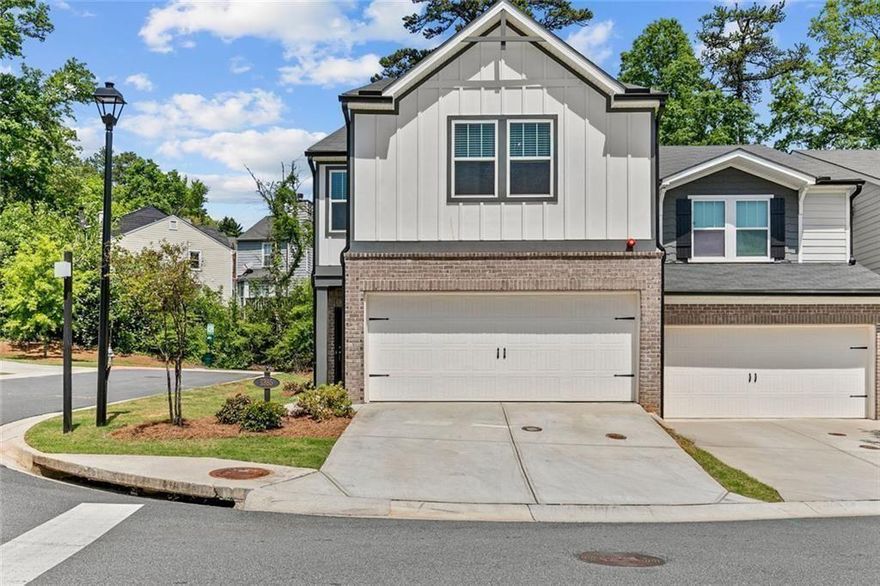 Savvy buyers, take note— this stylish townhome comes with a 2.99% FHA assumable loan and also qualifies for a 3.99% interest rate, no money down, and no PMI! You can take over this incredible low-interest rate and save big on monthly payments — or explore the alternative financing program for even more flexibility and savings. Step into style and comfort in this beautifully maintained, four-year-young end-unit townhome located in one of the area’s most desirable communities! Featuring a bright, open-concept floor plan and luxury vinyl plank flooring throughout the main level, this home is designed with modern living in mind. The chef-inspired kitchen boasts granite countertops, stainless steel appliances, an oversized island with seating, a generous walk-in pantry, and ample cabinet storage—perfect for everyday living and entertaining alike. Just off the kitchen, you’ll find a convenient half bath and a deep storage closet. Step outside to the private patio, ideal for grilling, relaxing, or hosting friends and family. As an end-unit, the home is filled with natural light streaming through expansive windows, creating a warm and inviting atmosphere throughout. Upstairs, plush carpeting adds comfort to the versatile loft space, great for a home office, playroom, or reading nook. The spacious primary suite offers a peaceful retreat with a walk-in closet and spa-like ensuite bath. Two additional bedrooms, each with their own closets, share a well-appointed full bath. This vibrant community offers fantastic amenities including a large dog park, playground, and firepit area—perfect for evening gatherings and making new connections. And the location? Truly unbeatable—just minutes from major highways, Kennesaw State University, local parks, popular restaurants, and everyday essentials like Costco, Whole Foods, and Target.