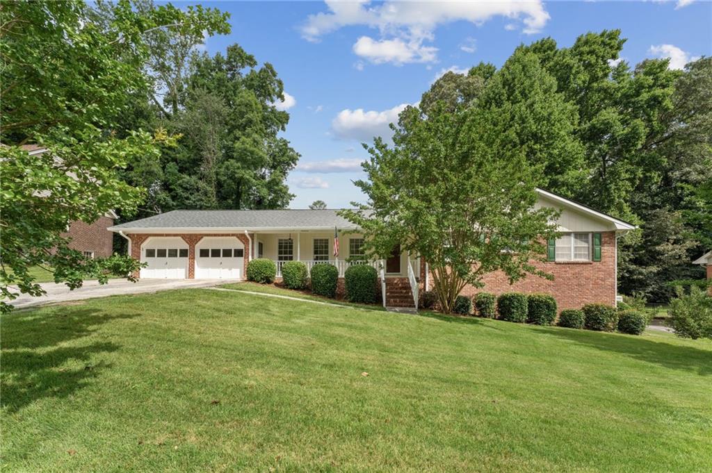 Stylish Brick Ranch with Finished Basement in East Cobbs Seven Springs Neighborhood!
This beautifully updated 4-sided brick ranch—accented with warm cedar trim—blends timeless curb appeal with modern comfort and thoughtful upgrades throughout.
The main level features 3-sun-filled bedrooms and 2-full baths, anchored by a spacious open-concept kitchen and family room. The kitchen showcases custom wood-stained cabinetry, generous counter space, and clear sightlines into the cozy family room with a gas fireplace—ideal for both relaxed evenings and effortless entertaining. Step outside from the eat-in kitchen or den onto one of two private decks, perfect for morning coffee or dining al fresco.
Downstairs, the fully finished daylight basement expands the home's versatility with two additional bedrooms or flexible-use rooms, a full bath, a wet bar, and a large bonus room—perfect for a gym, home theater, playroom, or creative studio. With interior and exterior access, this level is clean, dry, climate-controlled, and full of possibilities. There’s even ample storage space in the utility room or workshop-ready large closet.
Additional Highlights:
• Fresh interior and exterior paint
• Hardwood flooring on the main level; bedrooms recently professionally cleaned
• Brand-new luxury vinyl plank flooring in the basement
• New carpet in both basement bedrooms
• Updated vanity and lighting in the primary bath
• New lighting fixtures throughout
• New HVAC system (2023)
• New architectural shingle roof (2023)
• Under the same ownership for the last 47-years, this house has been well-cared for and maintained beautifully.
Located in the well-established Seven Springs neighborhood, this home offers the benefit of an optional HOA with no required swim/tennis and low annual dues of just $50, if you choose to join. Enjoy the unbeatable location—just a 6-minute walk to Merchants Walk Shopping Center with Whole Foods, Marlow’s Tavern, the cinema, and more right at your doorstep.