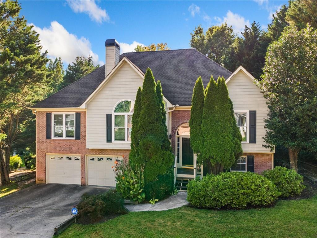 This stunning 4-bedroom, 3 full bath home located in a swim/tennis community, is within walking distance to shopping, dining, and local amenities. Thoughtfully updated, the main level features an open-concept layout with a spacious living room centered around a cozy gas fireplace. The kitchen shines with new granite countertops, a stainless steel dishwasher, and a stylish farmhouse sink — perfect for both everyday living and entertaining.
The main floor also includes the primary suite plus two additional bedrooms that share a full bath. Luxury vinyl plank flooring flows throughout the home, adding warmth and durability.
The fully finished basement offers a large rec room or second living space, along with a fourth bedroom and full bath — ideal for guests or multi-generational living.
Enjoy the outdoors from the comfort of the covered, screened-in porch, or soak up the sun on the brand-new open deck. A newly installed privacy fence completes the backyard retreat.