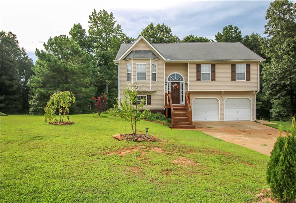 This beautifully updated home sits in a quiet neighborhood with no HOA. Step inside to new tile flooring, upgraded fixtures, a stunning kitchen with beautiful backsplash, a large master and master bath with seperate tub/shower. Step outside onto the gorgeous covered back deck that overlooks the large lot. This deck is perfect for entertaining and relaxing on! The downstairs is partially finished and ready for your finishing touch!