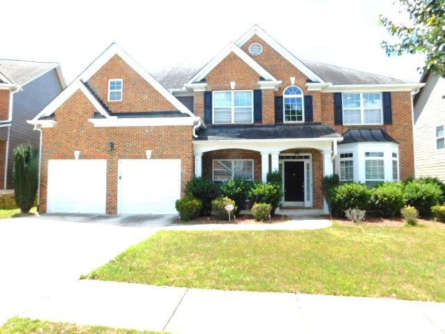 A covered porch leads to a 2-story entry foyer on the inside of the home. There is a separate living room and formal dining room. Main level has a spare bedroom and full bath. There is a two story family room with a fan/light, gas log fireplace, and built-in cabinets. The kitchen has wood cabinets, Granite counters and island/breakfast bar with tile backsplash, recessed lighting, and all appliances (refrigerator, gas stove, dishwasher and microwave), breakfast area with access to the rear patio. The upper level features three spare bedrooms with one attached to a full bath. There is also a full hall bath with tub/shower combination. Laundry room with washer/dryer hook-ups. The master bedroom has a trey ceiling and fan/light. The master bath has dual vanities, jetted tub, separate shower with enclosure and walk-in closet. There is a 2-car front entry garage. Highly desirable Grayson school district. Quick access to several shops and restaurants, as well as Hwys 124/316/78 and Sugarloaf Pkwy. No aggressive dog breeds.