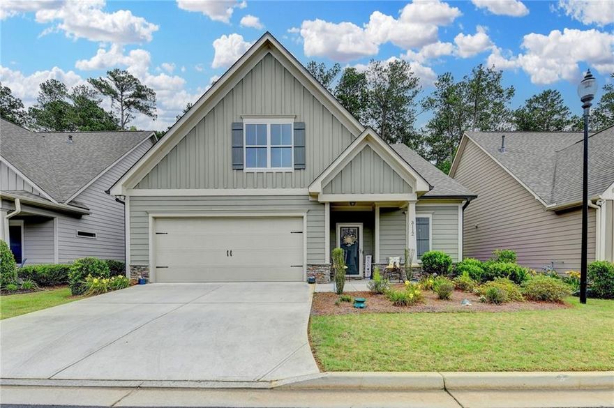 Located within a gated community, this Craftsman-style home features an owner's suite and guest bedroom on the main level, The Property boasts numerous upgrades, including wide plank hardwood floors, crown molding, and square vanity sinks with tile floors in the bathrooms.  The Kitchen, showcased in the open floor plan, features designer cabinets with soft-close doors and drawers, stainless steel appliances, granite countertops, an under mount stainless steel sink, and a tiled backsplash.  The great room offers an open concept with a fireplace and gas logs, the owner's suite is equipped with a luxury bath, featuring dual vanities, granite countertops, an oversized shower, and a spacious walk-in closet.  Additional highlights include a private guest bedroom with en-suite bath, storage, and two-inch blinds on all the windows.  A private sunporch is accessible from the great room or owner's suite.  The residence also features a two car garage with a carriage-style garage door.  This gated community, designed for residents 55 and over, offers a clubhouse, outdoor seating area and guest parking.