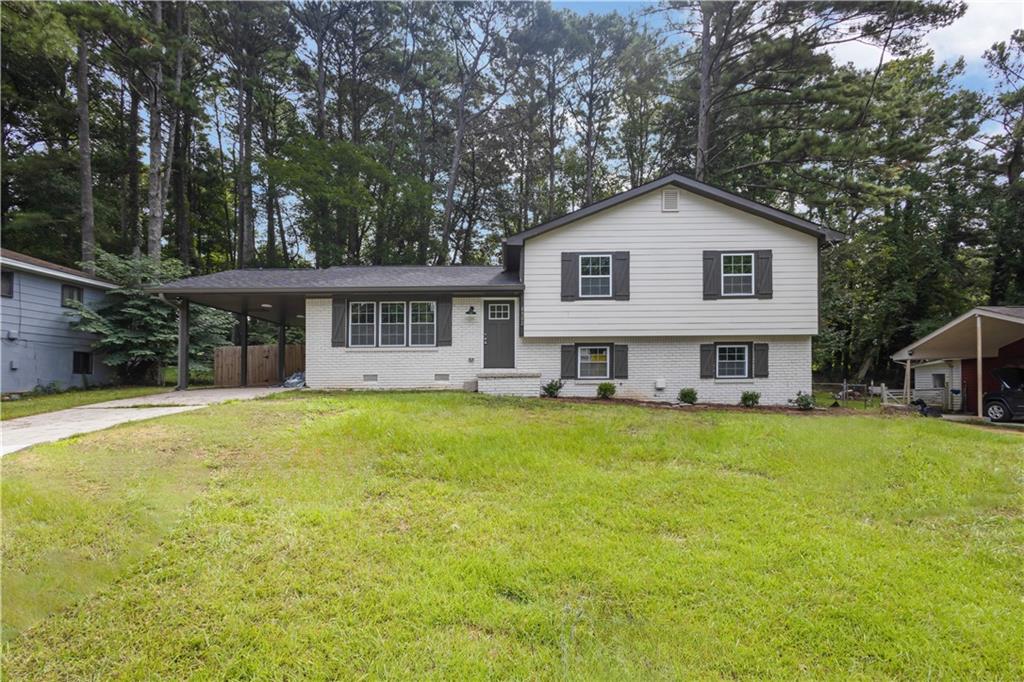 Discover this inviting 3-bedroom, 2-bath home in a quiet and established Conley neighborhood. The spacious floor plan features a comfortable living room with a fireplace, a bright dining area, and a kitchen with plenty of cabinet space. The primary suite includes its own private bath, while the additional bedrooms offer flexibility for family, guests, or home office needs. A large backyard provides room for outdoor entertaining, gardening, or play. Conveniently located near I-285, I-675, and quick routes into Atlanta, this home offers both accessibility and potential at a great value.
Make a great deal even better with Massive savings through special loan programs with the Preferred Lender Envoy Mortgage with Aubrey Wilcox! Ask the Listing Team for the introduction for up to 100% Financing or even interest rates in the 4s! Seller shall provide Stainless Steel appliances for kitchen at no additional cost to buyer!