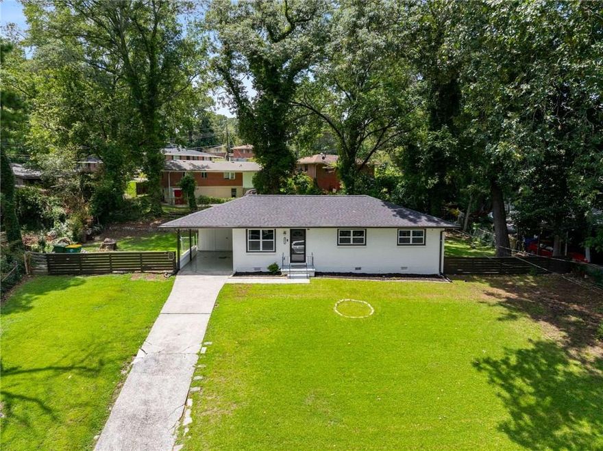 Discover your perfect home with this move-in ready, charming all-brick ranch! Featuring beautiful hardwood floors throughout, this home offers a spacious eat-in kitchen with granite countertops, a gas range, and stylish shaker cabinets. The updated bathrooms add a contemporary touch, ensuring comfort and convenience for you and your family.

Enjoy the private, fenced-in yard, perfect for relaxation or entertaining, along with the added convenience of a carport. Located just a short drive from the airport and vibrant Atlanta, this home ensures easy access to all your needs. Embrace the blend of charm and modern amenities—schedule your visit today and make this welcoming residence your new home!