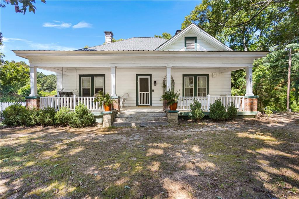 Welcome Home to Southern Charm! This beautifully maintained 2-bedroom, 2-bath farmhouse is filled with character and modern comfort. Imagine sipping sweet tea on the inviting front porch, or cozying up in the living room where the original pine and oak floors preserve the home’s rich history. The updated kitchen and bathrooms offer the modern convenience every buyer loves, while a versatile flex space with laundry hookups provides the perfect spot for a home office, playroom, or hobby area. Step outside and enjoy the serenity of the landscape that bursts to life each spring. Whether you’re gathering around the fire pit with friends or relaxing under the shade of the majestic oak trees, this property offers privacy and plenty of space to entertain. All this charm and tranquility comes with the convenience of being just 15 minutes to I-20 and 20 minutes to Hwy 78/285—the best of both worlds! Don’t miss your chance to own this enchanting farmhouse retreat—schedule your tour today!