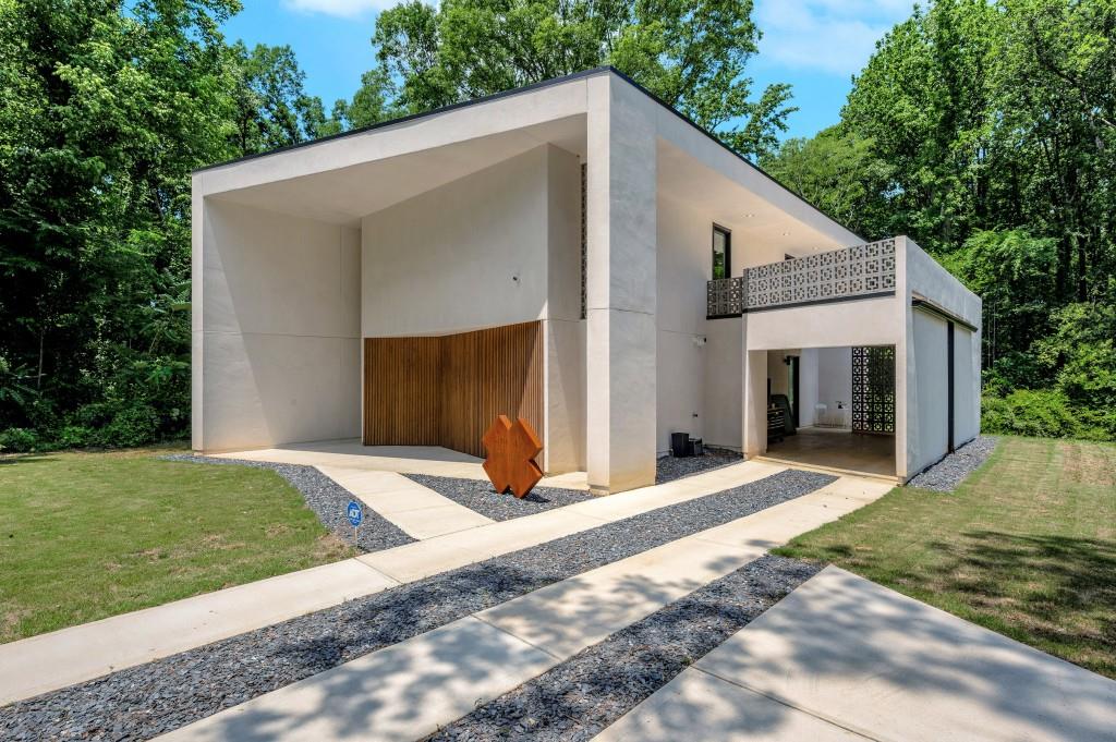 Welcome to 2525 Whites Mill Rd - a truly one-of-a-kind living experience. Designed by acclaimed artists Joseph Guay and Jeremy Brown, this stunning new-construction modern home is more than a residence it's a livable sculpture. Nestled on a private 1/2-acre lot in Decatur, this fully furnished 3-bedroom, 2.5 bathroom home showcases thoughtful design and custom finishes throughout. The interiors are lined with original artwork by the designers, creating a unique gallery-like atmosphere that blends creativity with comfort. Conveniently located just minutes from East Lake, Oakhurst, and Kirkwood, with quick access to downtown Atlanta and major expressways, the home offers both seclusion and accessibility. Every detail from high-end furnishings to curated decor has been chosen to elevate your everyday living experience. Rental is fully furnished with both furniture & artwork, and includes professional cleaning services and yard maintenance, making this a truly turn-key opportunity. Whether you're a creative professional, a design enthusiast, or someone seeking a home that breaks the mold, 2525 Whites Mill Rd offers an inspiring space unlike any other. Ideal lease term: 6-12 months. Home is managed by the Owner.