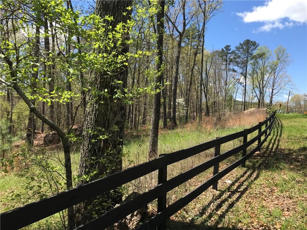 Cute 4/2 mobile on 10 acres!! Mobile on permanent foundation with all appliances included. Wooded rolling land with creek. Mobile needs TLC