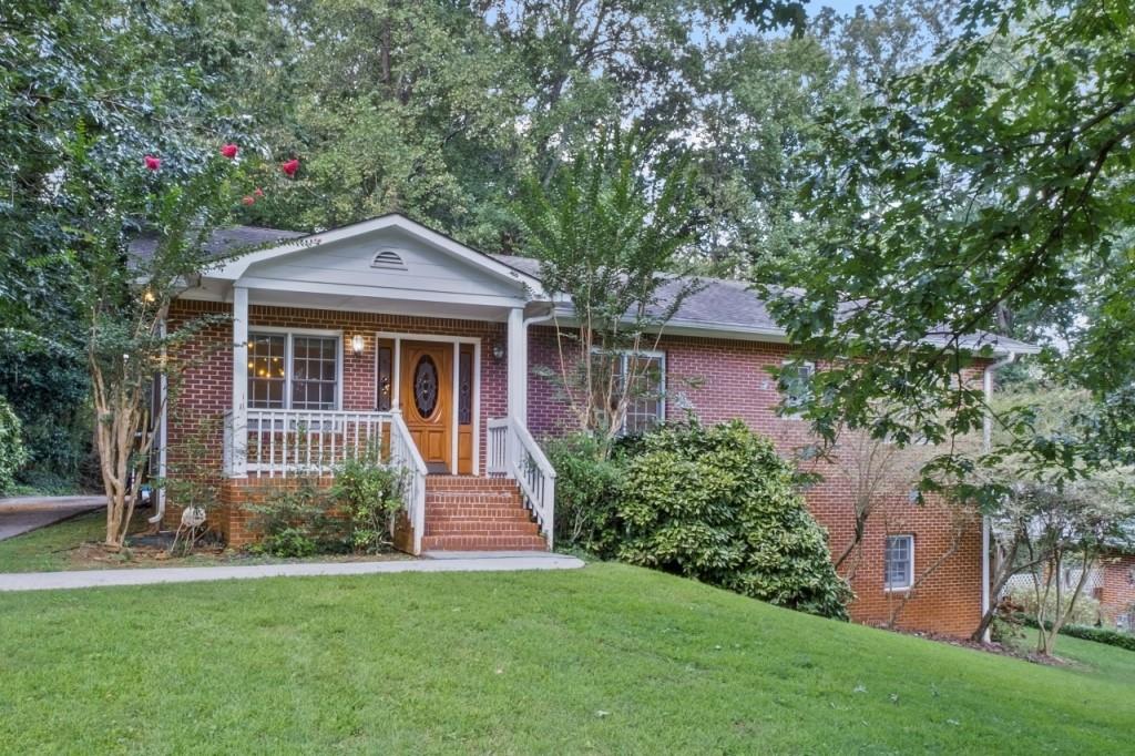 Welcome to this one-of-a-kind Marietta home that combines lodge-style character with modern comfort and incredible space. Rebuilt in 1996, this property delivers the charm of soaring cathedral ceilings with exposed beams, a dramatic stone fireplace, and gleaming hardwood floors throughout the main level. The open-concept design flows seamlessly into a chef's kitchen featuring a Sub-Zero refrigerator/freezer, 6-burner Dacor gas cooktop with commercial vent hood, Asko dishwasher, Corian countertops, and a central island perfect for everyday living and entertaining. With 3 bedrooms and 3 full baths, this home balances cozy retreats with flexible living. The highlight is the fully finished terrace level, offering a huge multi-purpose room, a full bathroom, and a dedicated projector/movie room an entertainer's dream that can also flex as an in-law suite, teen hangout, or private office. Car enthusiasts and hobbyists will love the oversized 4-car carport with RV/boat parking, a rare find in this market. The spacious lot provides room to spread out while still being just minutes from Powers Park, Cobb Parkway shopping and dining, and major commuter routes. This home is more than just a place to live it's a lifestyle. From movie nights in your private theater to gatherings under vaulted ceilings, 402 Terrydale is designed to impress.