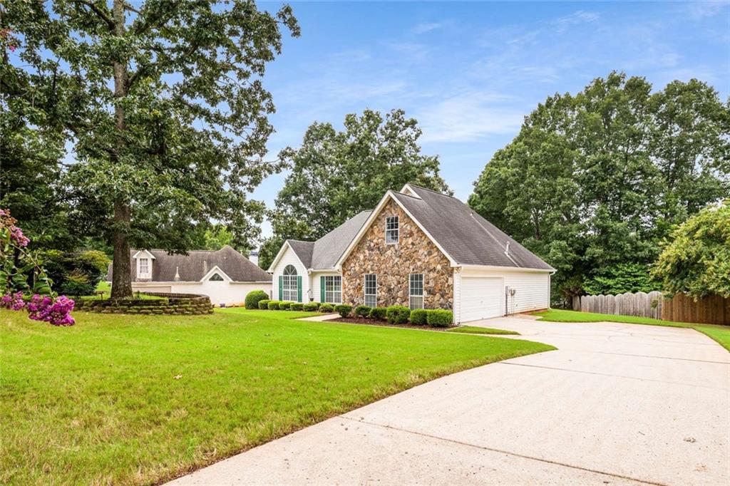 || MASTER ON MAIN || || NEW HVAC (2021) || || WHOLE HOUSE WIRING/ELECTRICAL (2024) || || FRESH PAINT, NEW FLOORING, & UPDATED BATHROOMS (2025) || || LEVEL DRIVEWAY & KITCHEN-LEVEL GARAGE || || 10 MIN TO DOWNTOWN MCDONOUGH || || CLOSE TO SHOPPING, DINING & INTERSTATE || || NO HOA & NO RENT RESTRICTIONS ||
** What You’ll See **
Step inside to find freshly painted walls, NEW FLOORING, and UPDATED BATHROOMS that give the home a polished, move-in ready look. The OPEN CONCEPT MAIN LIVING AREA connects the kitchen to the family room, framed by VAULTED CEILINGS that make the space feel airy and bright. Large INSULATED WINDOWS invite in natural light, while the landscaped yard adds charm to every view.
** What You’ll Hear **
Enjoy the quiet of a neighborhood without HOA restrictions, where you won’t hear the usual noise of ongoing construction or community traffic. Inside, the hum of ENERGY STAR QUALIFIED APPLIANCES blend into the background, allowing for conversations, laughter, and your favorite music to fill the open family room.
** What You’ll Feel **
From the moment you pull into the KITCHEN-LEVEL GARAGE, you’ll feel the convenience of an easy unload after shopping trips. Inside, the comfortable climate from the NEW HVAC system makes every room inviting year-round. You’ll also feel peace of mind knowing there’s a TRANSFERABLE HOME WARRANTY and recent upgrades to major systems, including WHOLE HOUSE WIRING/ELECTRICAL.
** What You’ll Experience **
Living here means the freedom of NO HOA & NO RENT RESTRICTIONS, plus being just 10 MINUTES TO DOWNTOWN MCDONOUGH and minutes from shopping, dining, and interstate access. Whether it’s hosting in the open living space, retreating to the MASTER ON MAIN, or enjoying the low-maintenance landscaped yard, you’ll experience both convenience and comfort every day.