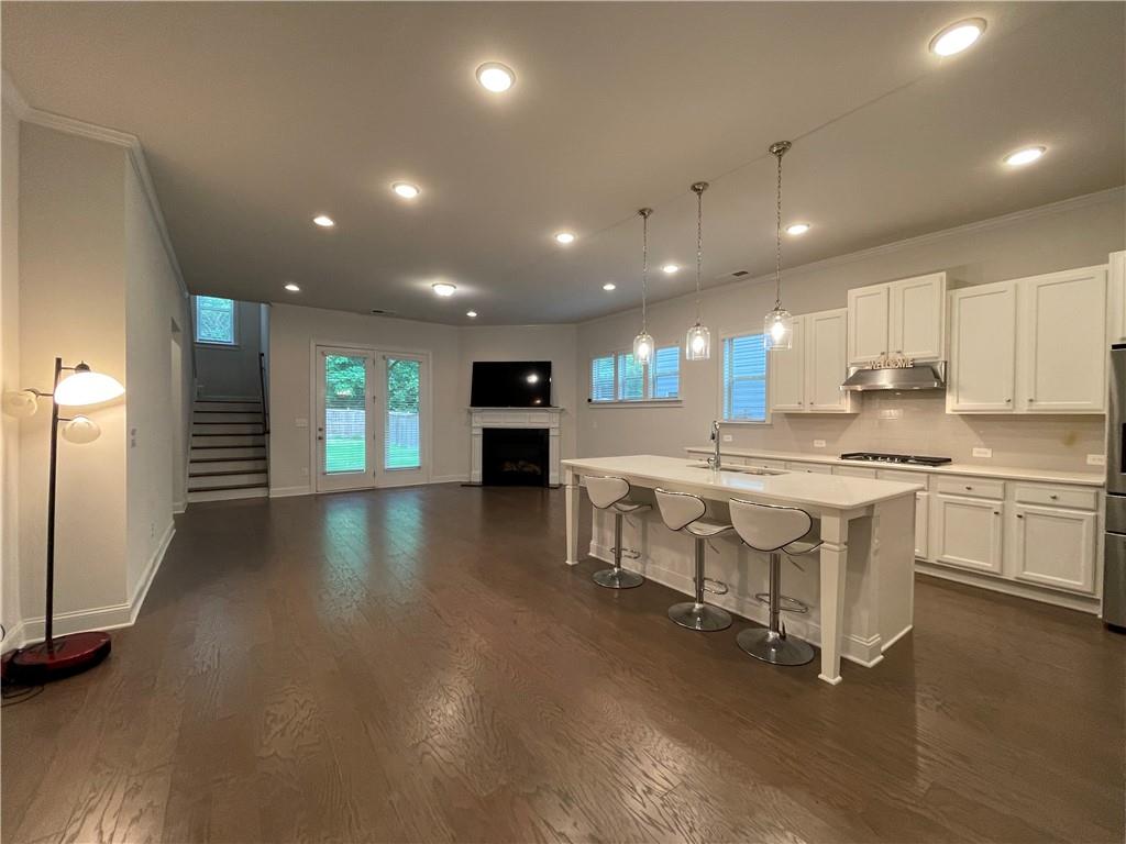 Newly built subdivision - Minutes from Emory University and Downtown Decatur. This Avondale Estates gem is everything you wanted it to be. Nestled into the triangle between I-285, Memorial Drive, and Avondale Estates, adjacent to the Kensington Marta Station, this home has every update possible in the neighborhood. Designer Granite, Stainless appliances, Upgraded Wood floors, Two Family Room areas - one down and one up. Primary Suite is on the main level, Upstairs, Three Additional bedrooms including a secondary Master Suite won't disappoint. Common area loft Covered Back deck overlooks level, fenced in backyard. Minutes to Emory Decatur, Avondale Estates, and the Interstates. Near Marta Kensington Station as well. Great neighborhood, great location, at a good price.