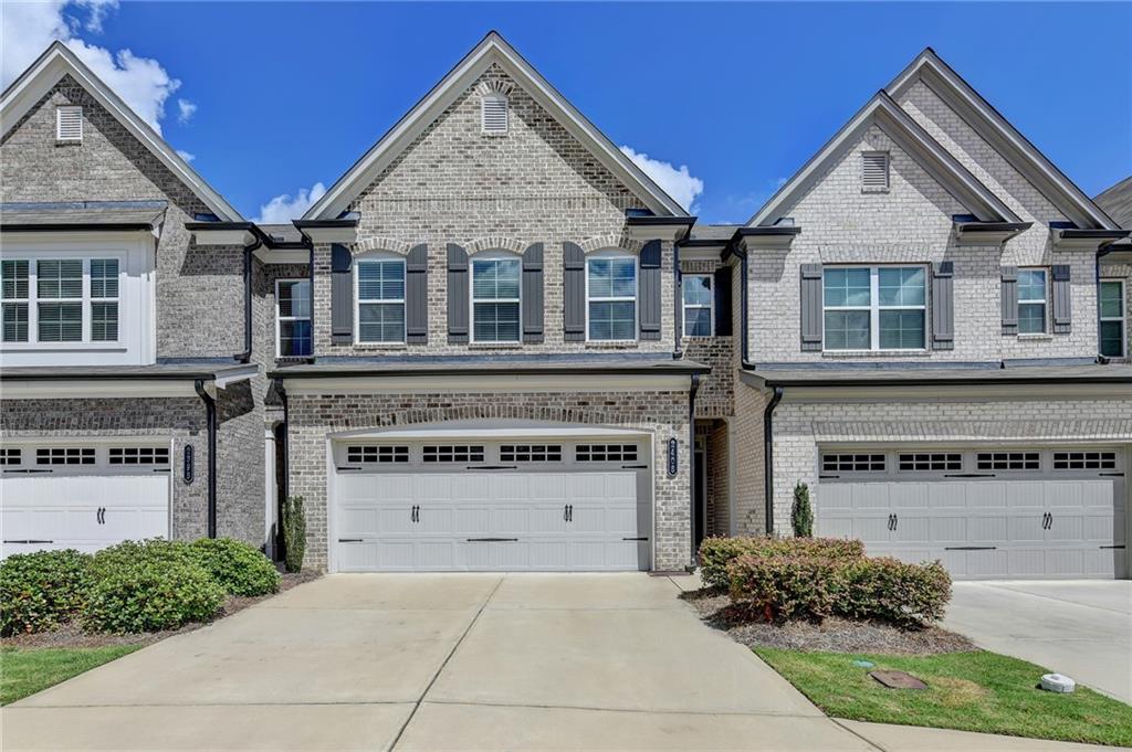 A Beautiful 3BD/2.5BA townhome in the Morgan Landing community built in 2021. Just minutes away from Hamilton Mill, Mall of GA, I-85, Close to schools, parks, restaurants, grocery, shopping, and entertainment, including Coolray Field, Baseball Stadium. The oversized owner’s suite w/tons of natural lights, tray ceiling, bath features double vanity, a separate walk-in shower, and a bathtub, w/ Huge walk-in closet. Open-concept w/ LPV flooring on the entire main level, living room with fireplace, half bath, dining. Large center Island w/white cabinets, stone countertops, stainless steel appliances.n Private walk-out patio. Excellent condition. Maintenance-free living in this convenient! HOA fee covers all exterior maintenance and landscaping w/low HOA fee