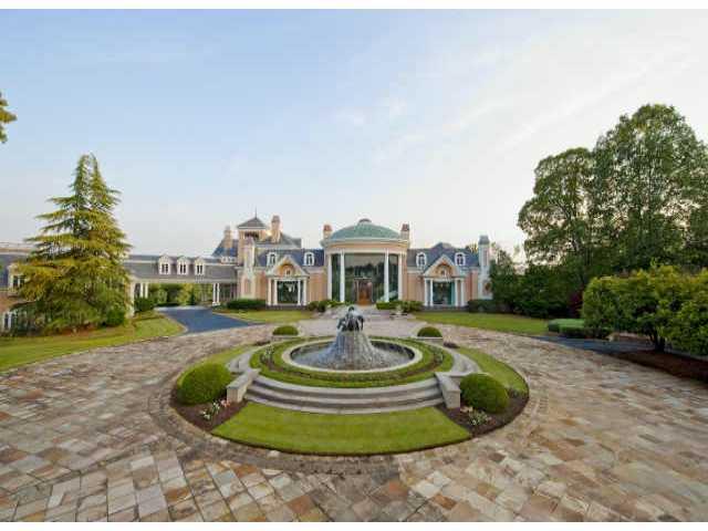 Recently appraised for $35 million, this 58 acre estate features a neo-classical style home designed by Bill Harrison, two carriage house apts, a caretakers cottage, wedding chapel, Asian tea garden, grass tennis courts, amphitheater, conservatory ,lake and 18 hole golf course.Equestrian use as well