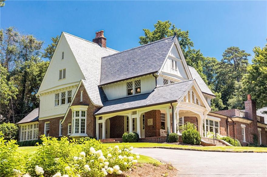 This must-see 1930’s Buckhead estate consists of an updated English Tudor home on 3+ sprawling acres located along the highly sought-after Habersham Road. This property has been meticulously maintained to preserve its classic beauty with recent renovations by some of Atlanta’s top architects and builders.  This incredibly private hill-top property is certainly one of the premier lots in Buckhead, and includes a lovely renovated main residence, carriage house and pool.
 
Upon entering the home, you will find 10+ foot ceilings, hardwood floors and a beautiful oriel window that allows generous natural light to enter the foyer. You will also recognize many unique architectural details including: plaster walls, hand-carved mantels, leaded-glass windows, wood paneling, intricate moldings, iron doors & windows, and designer wall-coverings and finishes.  Main level living areas include Living Room with fireplace, large Dining room, Sunroom that is currently being used as a light-filled home office, Library with fireplace, and a Breakfast room with floor-to-ceiling windows.  The Kitchen was recently renovated which includes expansive custom cabinetry with tremendous storage, full-sized Sub-Zero refrigerator & freezer, two Bosch dishwashers, Thermador Range, stone countertops, and a wet-bar area with a wine refrigerator. The Family room is located off of the kitchen and is filled with custom millwork and has French doors that open to the Pool Terrace.  The Master suite is on the main level and underwent a full renovation this year.  It features fixtures and finishes from Waterworks, has heated marble floors, dual vanities, freestanding bathtub, a large marble shower, and connects to an enormous walk-in closet with oversized island and custom cabinetry.  The new main level laundry room is also conveniently located in between the master suite and primary living areas.  There are 2 separate terrace levels: 1) unfinished cellar area that serves as storage space, and 2) lower level basement garage that originally accommodated 6 cars, but has been partially finished to include more dedicated storage space. Other home amenities include a new Generac generator, well-fed irrigation system, outdoor lighting, and a new whole-house water filtration system.
 
Walk-out heated pool and spa consists of a pebble-tec and a saltwater system, and there is also an expansive bluestone patio and koi pond that provide for a perfect atmosphere for wonderful poolside entertaining.  As you continue towards other parts of the grounds, you will enjoy views of pristine gardens and landscaping, new hardscapes and firepit, custom iron gates and fencing that encompass much of the property, yet still reserves an undisturbed greenspace to the rear lot line for the ultimate privacy in such a coveted location. 
 
The charming carriage house features an additional bedroom, full bath, and a new kitchenette area that makes for easy and convenient while entertaining at the rear of the property.  This structure has new windows and doors, custom millwork and cabinets, New appliances and countertops, new paint, new copper gutters and downspouts, and a 4-6 car garage with custom flooring that can also be used as a gym or for car storage.  This is truly one of Atlanta’s most remarkable properties that is perfect for the most discerning home buyer!