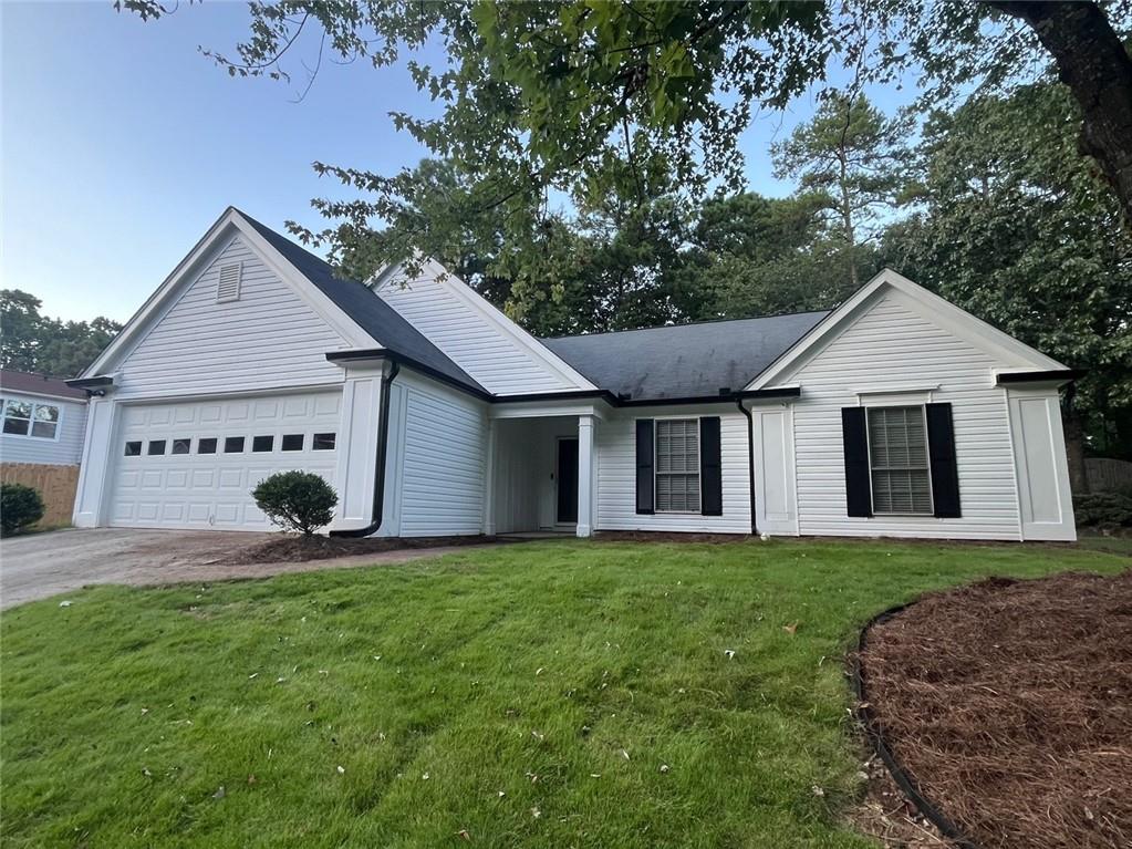 This gorgeous Traditional Ranch Home showcases exceptional craftsmanship. Walk to award-winning schools in the Johns Creek school district. Located in the heart of Johns Creek - named #1 Best Place to Live in the U.S. per USA Today in 2025. The home features 3 bedrooms, 2 baths, and approximately 1,776 sq ft of living space with hardwood, LVP flooring, and is newly painted. Primary bedroom suite features brand new beautiful LVP flooring, new soaking tub, new separate shower with frameless glass, double vanities, and a walk-in closet. There are two other bedrooms with new LVP flooring and a light and upgraded second full bath. The gourmet kitchen has natural light and easy grocery drop off directly from the 2-car garage. There is plenty of cabinet space. There is a separate breakfast room, a formal dining room, a convenient laundry room with washer and dryer next to the kitchen. The family room has a great fireplace - perfect for entertaining. Also featured is an enclosed sunroom for exercise or having your morning coffee overlooking the private backyard. This home is not only walking distance to top-rated schools, but also conveniently close to shopping, dining, golfing, parks, and entertainment. Easy commute, less than 5 miles SE from SR-400, less than a mile W from SR-141, and about 10 miles W from I-85 exit 109. This beautiful home is ideal for family living and is available for lease for 12 months or longer. Landscaping is included in rental price. Preference is given to applicants with a credit score of 700+ and a monthly income at least three times the rent. All applicants over the age of 18 must apply via RentSpree for $49.99 per applicant.