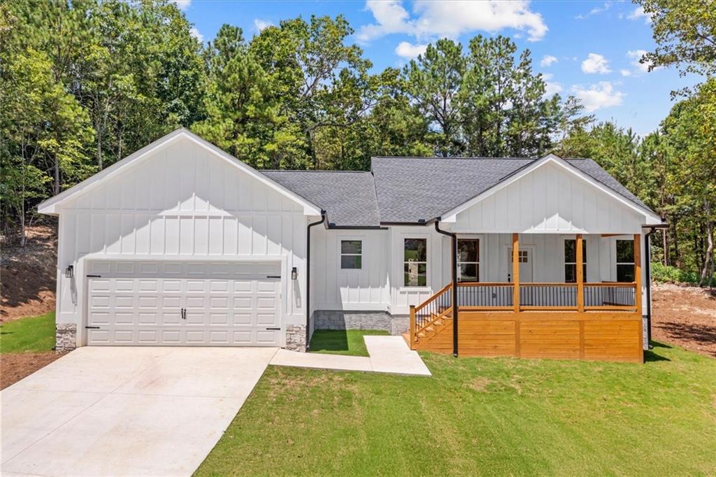 BEAUTIFUL NEW CONSTRUCTION HOME IN ROCKY FACE, GEORGIA. The home features a kitchen with a large island, walk-in pantry, and a separate laundry room. The living room has cathedral ceilings and a cozy chimney, creating a warm and open feel. Enjoy the outdoors on large covered decks, with Bermuda grass, a long driveway, and an attached garage. Inside, you’ll find walk-in closets and plenty of natural light throughout. This home offers comfort, space, and peaceful country living.