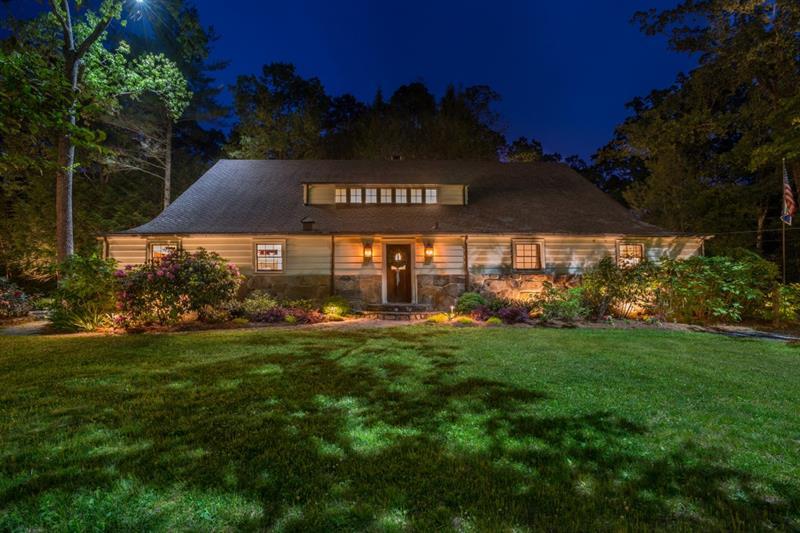 Enchanting! This Historic property offers multiple opportunities as an Inn, Bed and Breakfast, Hotel or Special Events venue! ONE OF A KIND LAKE RABUN PROPERTY! Exquisitely remodeled by skilled professionals who have preserved the fabulous native stone walls, stone flooring and timber! The heart-pine floors and striking features in this historic, 100 year-old structure will captivate! This property is a special part of Lakemont history. Originally built by the Samuel Candler Dobbs family for their horses, this stunning barn has been converted to a 7 bedroom, 8 full and 1 half bath luxury lodge. It is able to provide roomy accommodations for groups or intimate living for more private enjoyment. Enjoy multiple gathering spaces designed to impress for warm fireside conversations, cozy family interactions, impressive entertaining or the quiet media, TV room. Gather round the spacious double-dining area for family meals, grab a casual bite at the kitchen island or expand the party to the 1000 sq. ft outdoor deck for larger events. There is no limit to what the outstanding commercial grade kitchen can prepare, for gourmet feasts or a catered affair. There is more for your enjoyment outside on this beautiful property that boasts a view of Lake Rabun that offers the ideal setting any time of day or night! Throw a ball in the front yard green space, the perfect spot for sport. Relax in the afternoon under manicured hardwood trees. In the evening watch the sunset's dappled light from the comfort of Adirondack chairs, and at night with the grounds magically alive with the best professional lighting, gather round the stone firepit to roast marshmallows and tell moonlight stories. Walk to the Lake Rabun Marina for boat rentals and public boat launching ramp, great restaurants or the Lake Rabun Pavilion for community events. Conveniently located across the road from beautiful Lake Rabun where you will delight in all the water activities that this pristine lake affords! Additional pleasure awaits with nearby golf and tennis. Explore the outdoor adventures in the area: hiking, river rafting, trout fishing on the Soque River, kayaking at the Tallulah Gorge State Park or visit the Yarn Nature Center. Store all your gear in the large outbuilding which could be remodeled to be a garage. The horse-themed furnishings and accessories carefully curated by a well known interior designer add to the ambiance of this historic property . All the furnishings are available for purchase if you desire to have a turn-key, ready to move in property.