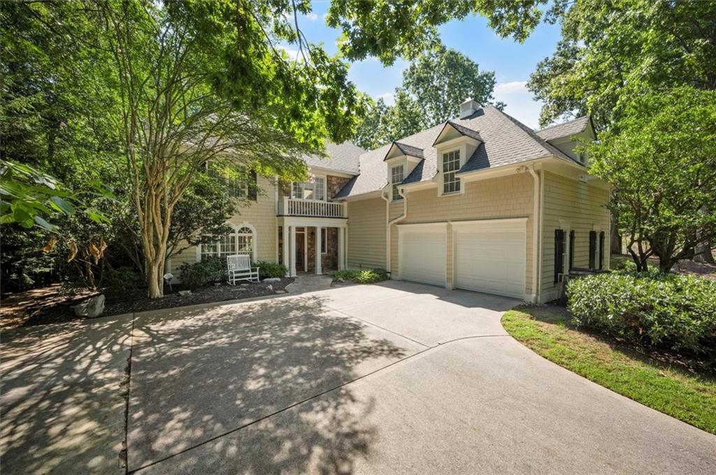Nestled on a serene cul-de-sac in the sought-after Spalding Heights neighborhood, this beautifully renovated home sits on a lush, private 0.8-acre lot that feels like a tranquil retreat! Upon entering, you're greeted by soaring high ceilings and gleaming wide-plank hardwood floors. Fresh paint and modern lighting add a crisp, inviting ambiance throughout. The heart of the home, the kitchen, includes a spacious island, breakfast bar, pantry, and a sunny breakfast nook adjacent to a cozy keeping room—perfect for casual gatherings or morning coffee. The two-story foyer leads into a grand great room with a coffered ceiling, where large windows offer scenic views and abundant natural light. Step through sliding doors to the screened porch and flagstone patio—ideal for entertaining or quiet relaxation. A charming terraced waterfall flows into a koi pond, adding a touch of serenity to the backyard oasis. A versatile bedroom/office with an adjacent full bath on the main level offers both flexibility & comfort-perfect for guests! Upstairs, the Primary Suite is a private sanctuary, featuring a tray ceiling, sitting area, spa-like bath with dual quartz vanities, a soaking tub, roomy shower, and an expansive walk-in closet. Three additional bedrooms and two upgraded baths complete the upper level. Outside, the fully fenced backyard features a Japanese garden, mature landscaping, and a generous level area perfect for a fire pit, play set, or simply enjoying time outdoors. This home’s prime Sandy Springs location offers both tranquility and convenience. It’s just minutes from Dunwoody Country Club and nearby shopping and dining options, providing the perfect blend of suburban peace and city-side amenities. This gem offers an exceptional opportunity to own a captivating and thoughtfully updated residence that perfectly balances indoor elegance with outdoor charm. Ideal for entertainers or anyone seeking a serene sanctuary with modern comforts and effortless access to the best of Sandy Springs!