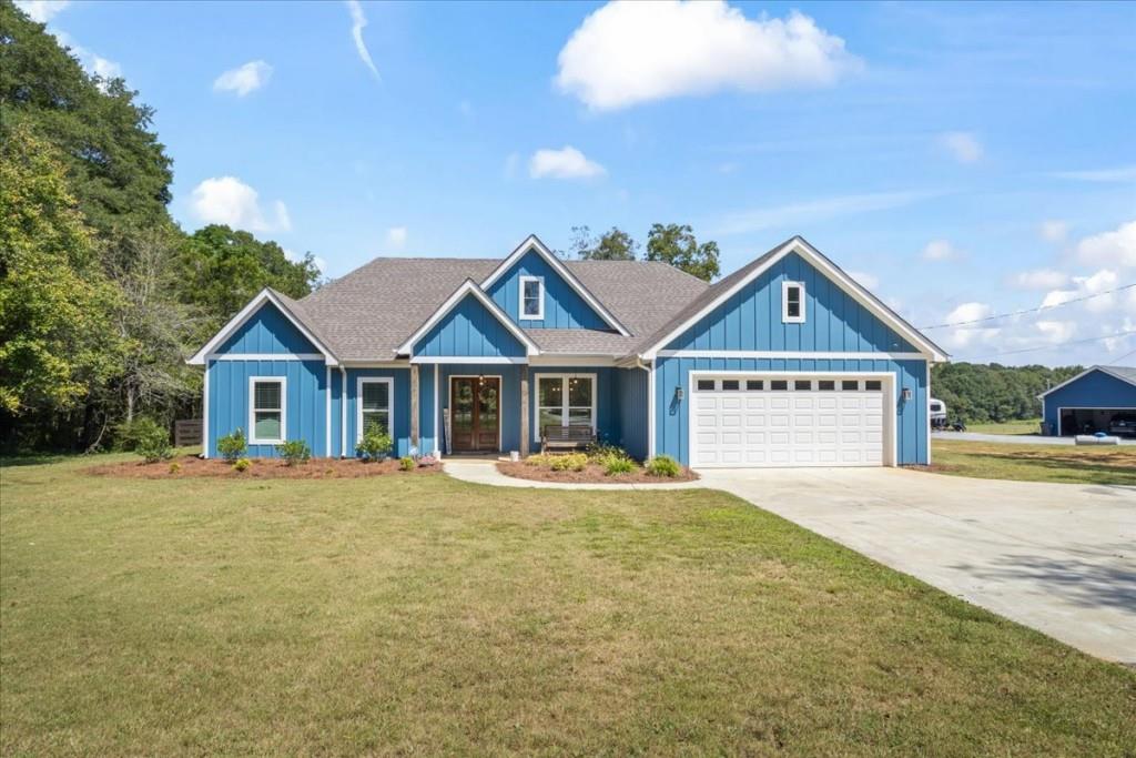 Welcome to your Dream Home in the heart of Newborn! Built just 2 years ago, this beautifully maintained 4-bedroom, 2-bathroom home features an open floor plan perfect for modern living and entertaining. With stylish finishes, abundant natural light, and a seamless flow between the living, dining, and kitchen areas, this home offers both comfort and functionality. Step outside and take in the expansive 3.39-acre lot ideal for outdoor living, gardening, or simply enjoying the privacy and space of rural life. The partially fenced in backyard, along with an underground electric dog fence extending to the front of the property, provides a safe and secure space for your pets to play freely. This homes septic system is located in the front yard, ready for your private pool to be built in the back. A true standout feature of this property is the 30x50x12 shop, designed to meet all your hobby, business, or storage needs. It includes two 10-foot barrel-style roll-up doors,a convenient man door for easy access, 125 Amp electrical service, water line and plumbing drain line installed, ready for a full bathroom build-out. Whether you're looking for a workshop, a home business setup, or serious storage for vehicles and equipment, this shop delivers unmatched versatility. Don't miss your chance to own this rare combination of modern home comfort and serious shop space all set on a peaceful, spacious lot just minutes from town!