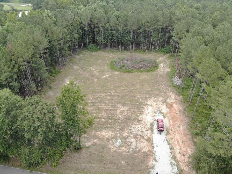 Build Your Dream Home on 4.5 Private Acres? No HOA! Nestled in the sought-after Central School Cluster, this ready-to-build 4.5-acre tract offers the perfect combination of privacy and convenience. The homesite is already cleared, a driveway installed, and a soil test completed, making your building process smoother than ever. Utilities are available at the street, including public water and high-speed internet, so you can enjoy modern comforts while embracing the quiet serenity of nature. Located just a short drive to Carrollton City, this property provides easy access to shopping, dining, and entertainment while keeping you tucked away from the hustle and bustle. No HOA. Just your land, your vision. If you're looking for a peaceful slice of property to bring your dream home to life, this is it!