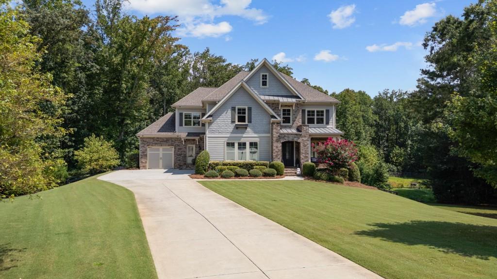 Nestled on a secluded 1.58 acre cul de sac in Milton's Taylor Estates, this thoughtfully designed home offers five bedrooms and 51/2 baths across 4,608 sqft. The main level features an open layout connecting the bright eat in kitchen-with walk in pantry and stone counters-to the dining area and two story great room that opens to a composite deck and expansive backyard. A private guest bedroom with a private bath and side entry access adds convenience and flexibility. Upstairs, a large bonus area sits alongside the primary suite, laundry room, and three additional bedrooms. The terrace level is custom built for entertaining with a theater room, bunk room, family and billiards areas, fitness room, full bath complete with custom sauna, and access to a covered deck featuring a day bed swing. The outdoor retreat continues with a paver patio leading to a heated, saltwater pool, fire pit, and sports court. Located near award-winning schools, the Crabapple district, downtown Alpharetta, and Avalon, this home is move-in ready and comes with over $50,000 in recent updates to landscaping and flooring, emphasizing both its refined design and outdoor appeal.