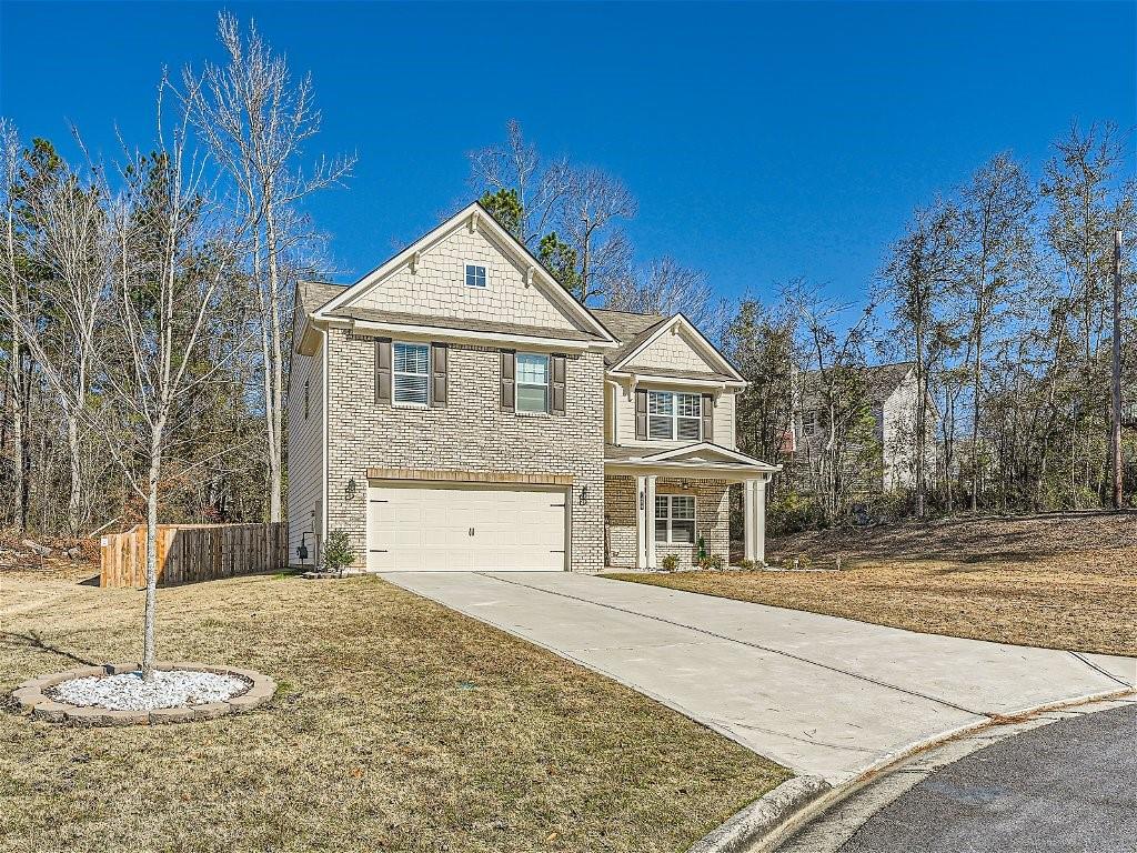 Welcome home to this charming 4 bedroom brick front home nestled in a peaceful cul-de-sac in Douglasville! Upon entering your home, you are immediately greeted with custom flooring that graces the main level and leads you to the heart of the home. The updated kitchen boasts a gas stove top, stainless steel appliances, an oversized kitchen island complemented by a huge walk-in pantry and an eat-in dining area that invites in a ton of natural lighting. Imagine cozying up near the brick fireplace after a long day. The primary bathroom features a double vanity, a luxurious stand-up shower, garden tub and a spacious walk-in closet. The fenced backyard provides a private retreat, with serene views perfect for outdoor gatherings and play. This property speaks for itself so come experience this charming home for yourself and take it off the market today!